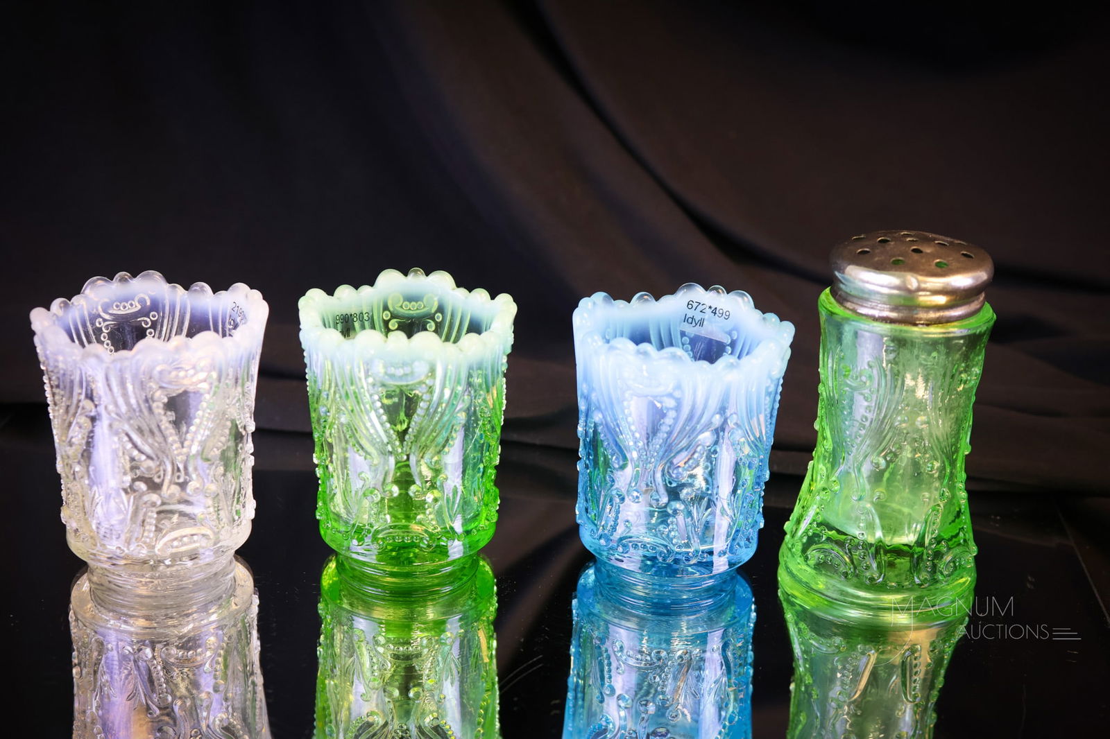 4 pc Lot Jefferson Victorian Opalescent Glass: Four selections in Victorian Jefferson glass that are sure to please. This lot offers a white, green, and blue opal toothpick holders and lastly, a green salt shaker. The tallest measures 3 1/4". Ship