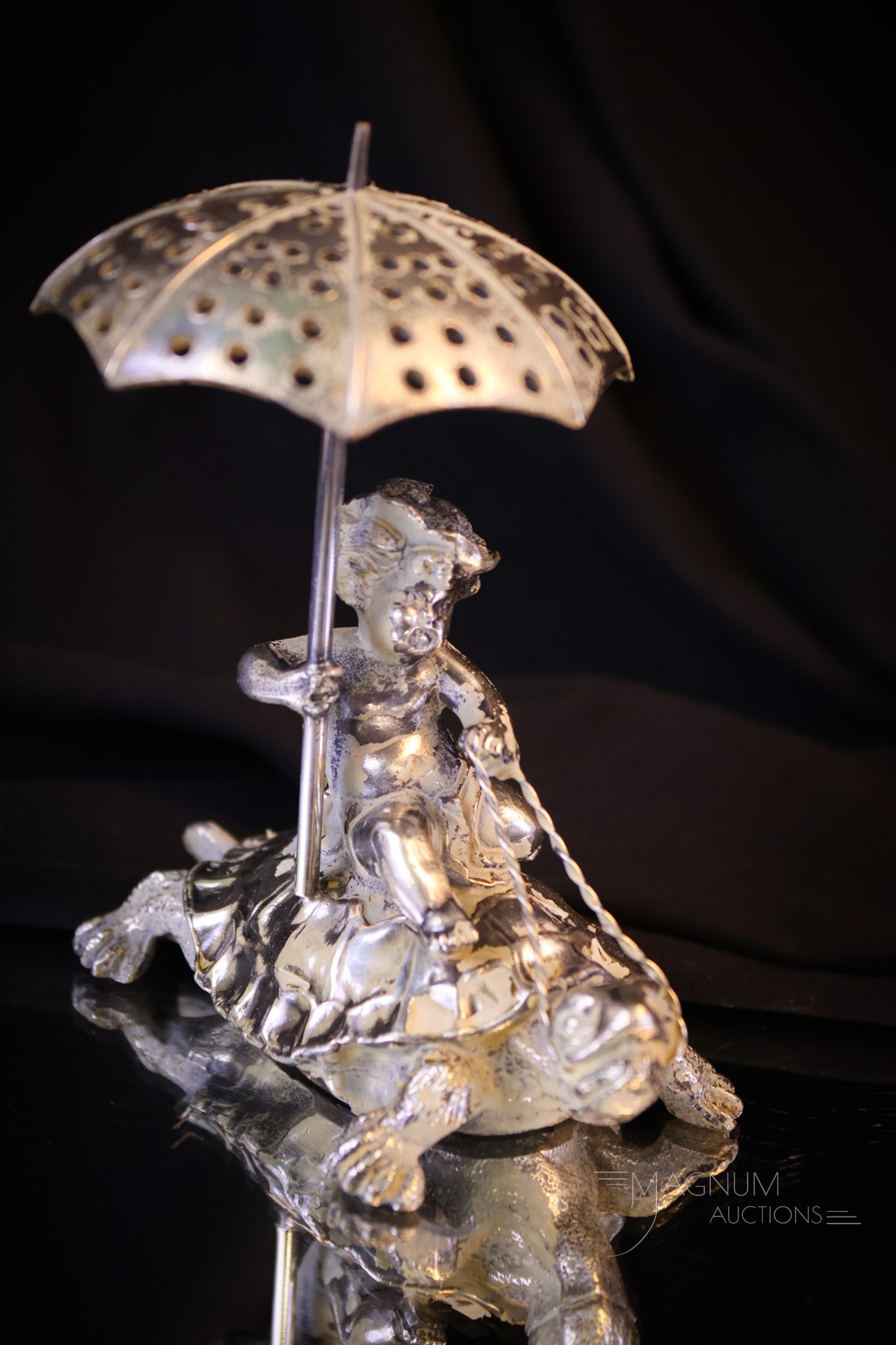 Pairpoint Figural Silverplate Putti On Turtle Victorian Toothpick Holder: A highly collectible find in Victorian silverplate. This is a signed Pairpoint putti with an umbrella on a turtle back toothpick holder. This cute and whimsical find will make a smile come across your