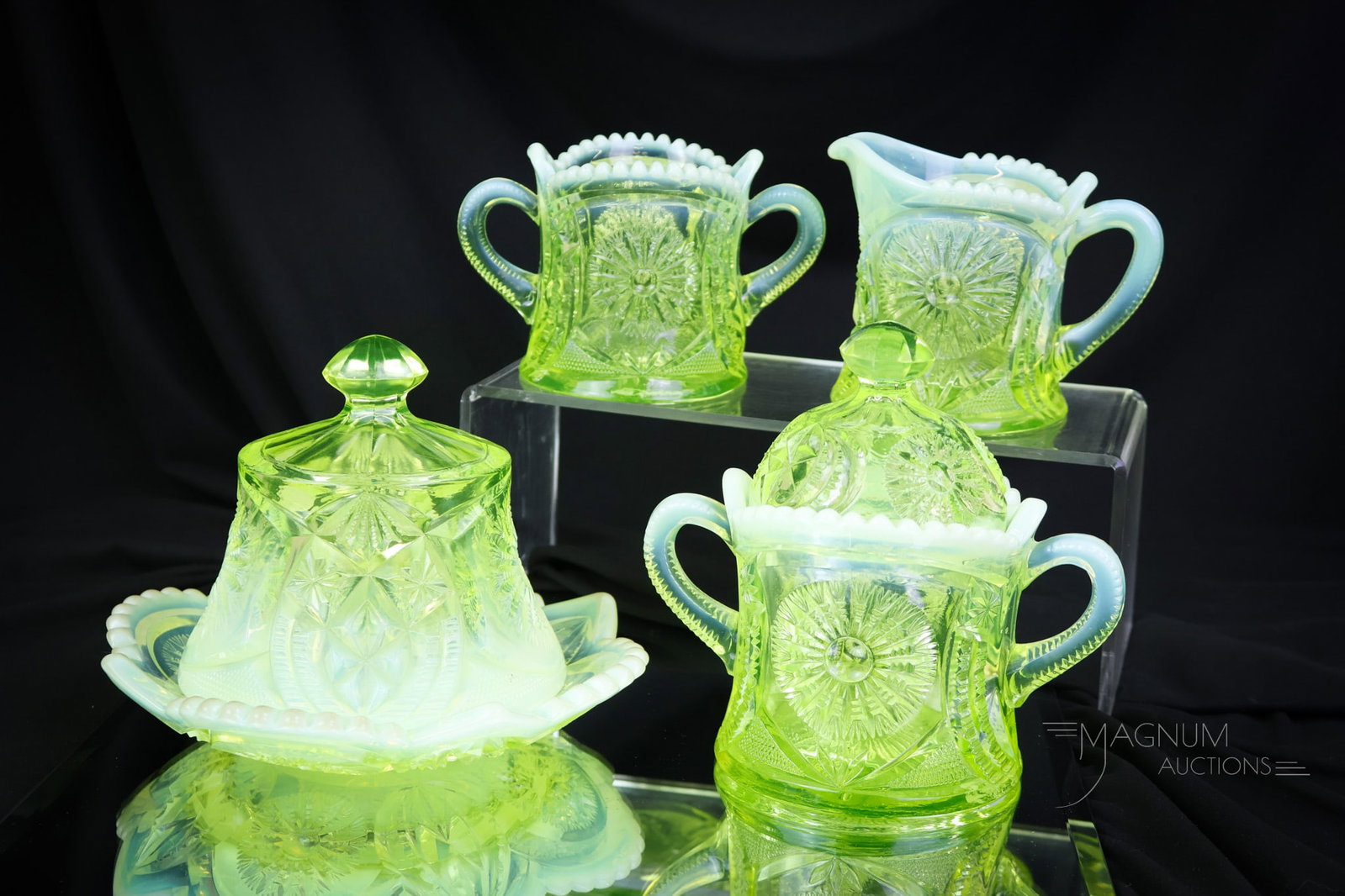 Northwood Sunburst on Shield Vaseline Uranium Opalescent Glass Table Set: A Victorian vaseline table set in one of the most desirable patterns. This fine set is in the Sunburst on Shield pattern. The set is complete with all four pieces. Tallest of the set measures 6" tall 