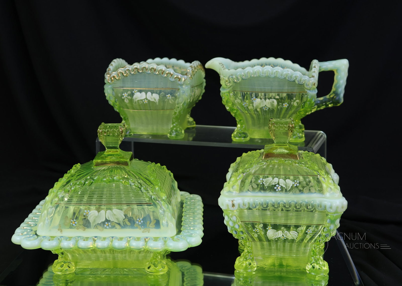 Victorian Vaseline Uranium Opalescent Northwood Glass Alaska Decorated Table Set: An exciting and brilliant vaseline opalescent table set made by Northwood in the Alaska pattern. Each piece of the set is lavishly decorated with gold and enamel. The set consists of all four pieces. 