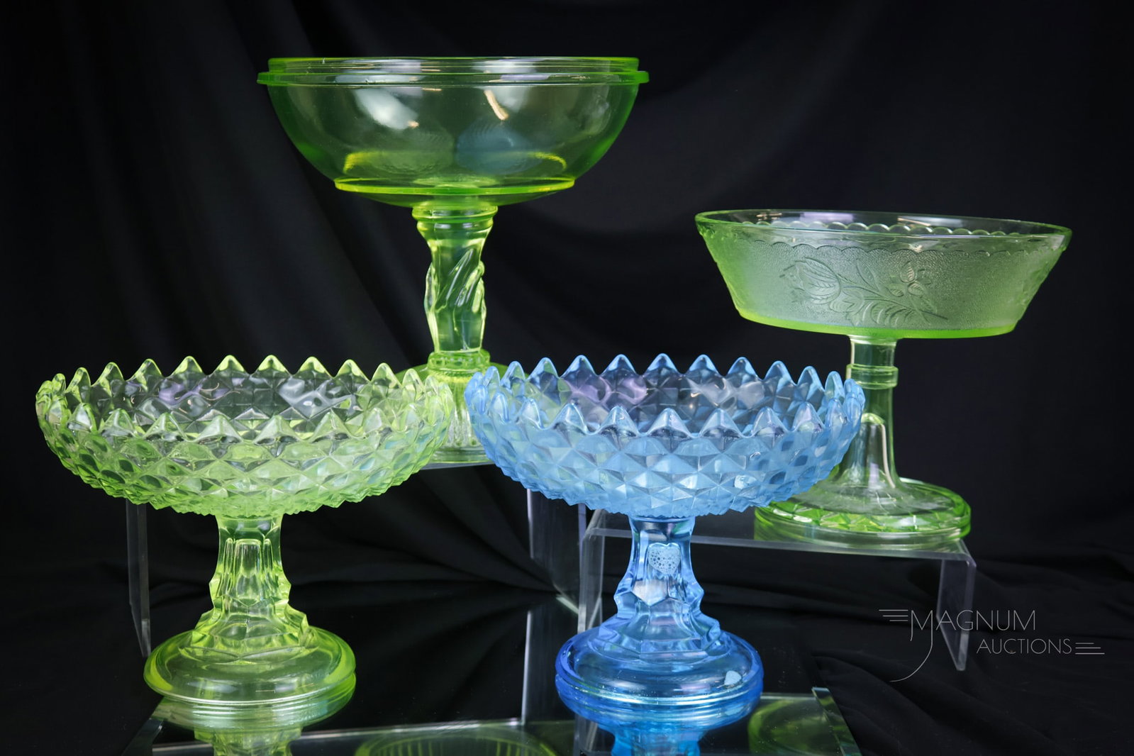 4 pc Lot Victorian Compotes Vaseline Uranium & Blue Glass: Four delights that are sure to bring a smile to your face. This lot includes two compotes in the sawtooth pattern. One in the Roses in Snow pattern. Lastly, a vaseline compote with a figural hand stem
