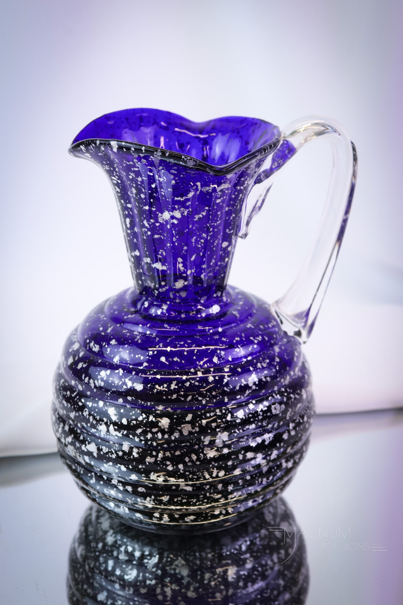 Hobbs Cobalt Victorian Spangle Glass Rings Mold Water Pitcher: Another seldom found piece of Hobbs glass. This pitcher has a bulging ring pattern to the body. The pitcher has silver flakes and a clear applied handle. The pitcher measures 8 1/2" tall. SHIPPING NOT