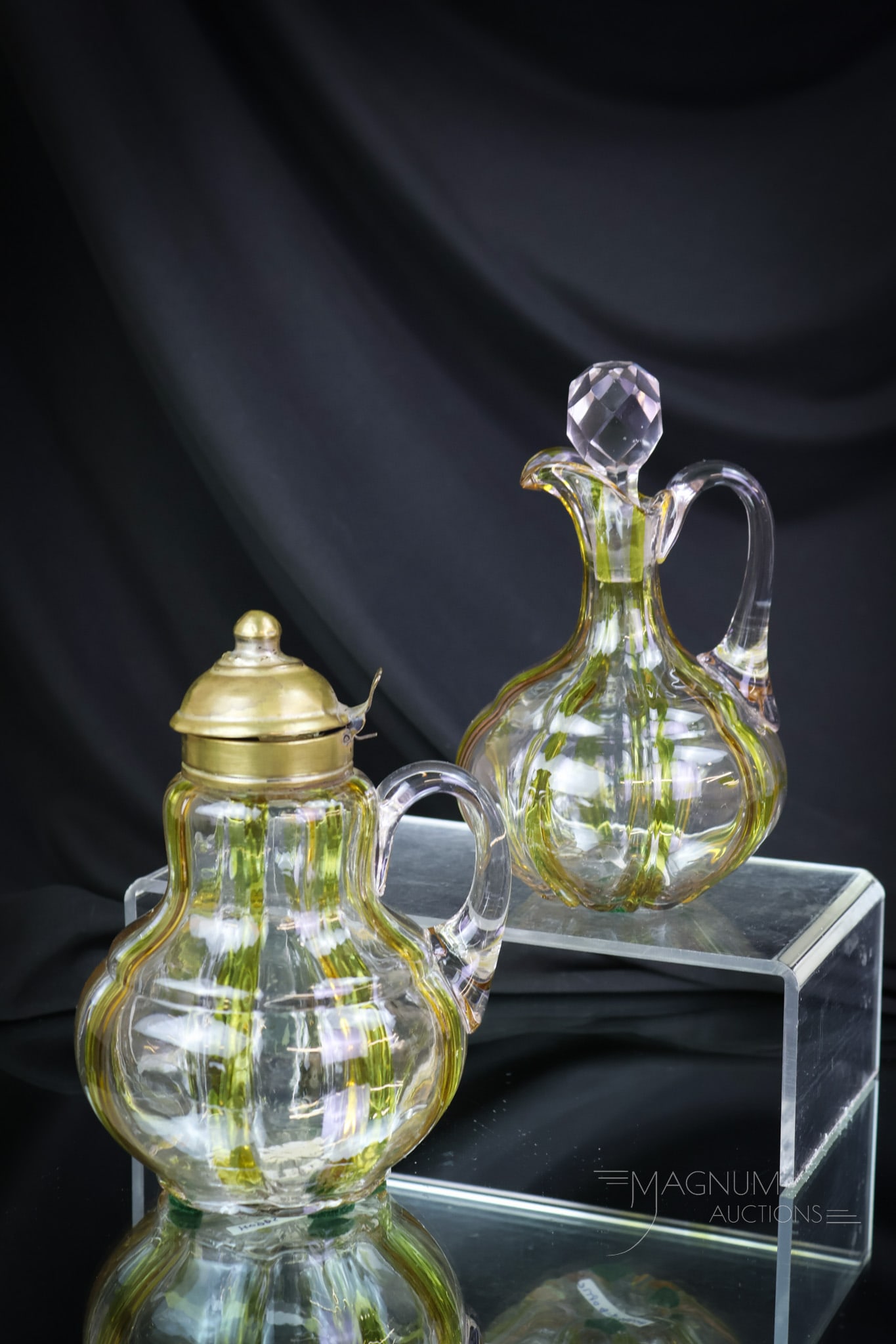 2 pc Lot Hobbs Amber Stained Victorian Glass Cruet & Syrup Pitcher: Two rare examples of Hobbs Victorian glass. This lot is made up of a syrup and cruet in the Bulbous Base pattern. Each piece is amber-stained decorated with vertical stripes. The tallest of the offeri