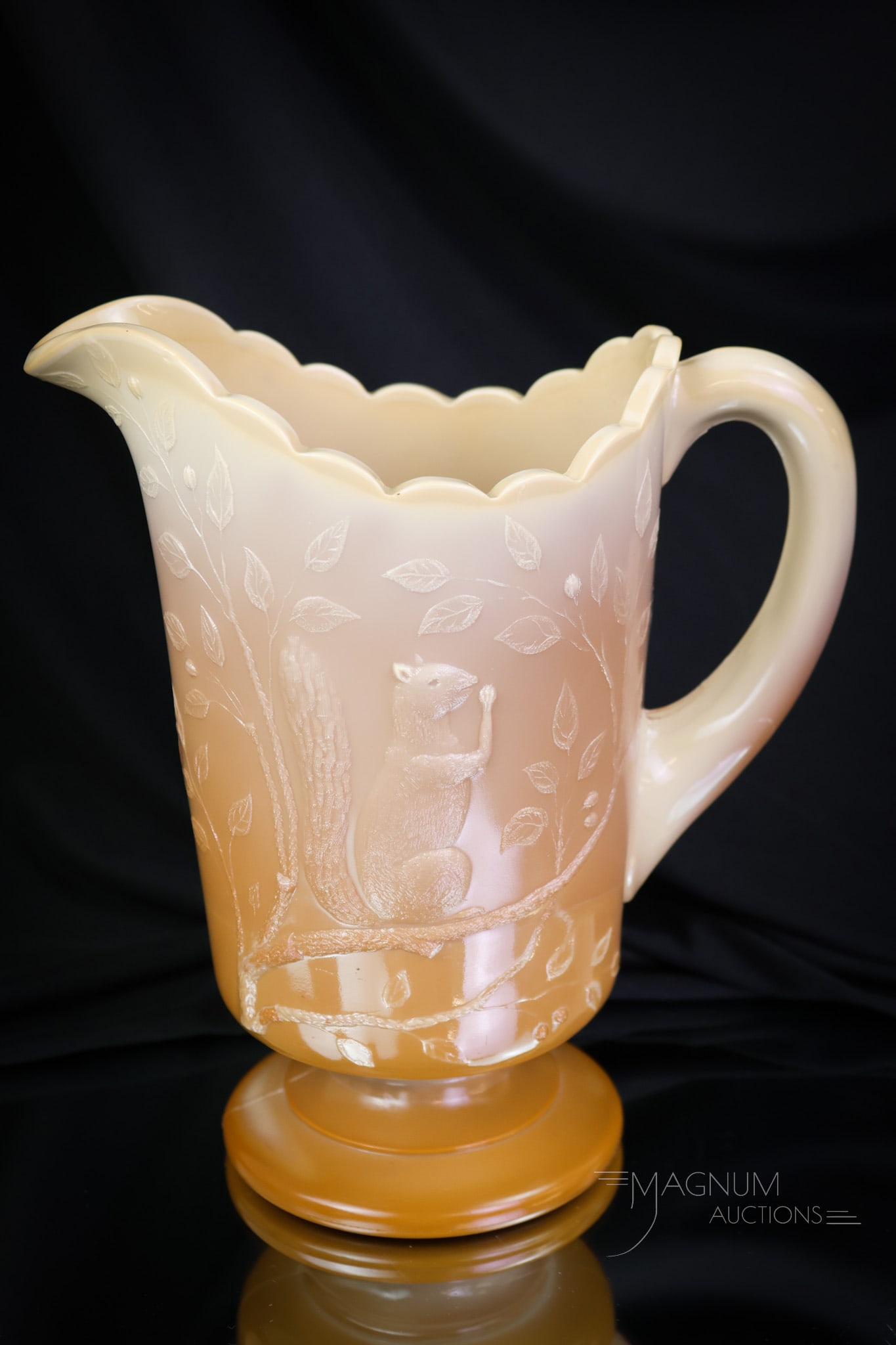 Greentown Chocolate Glass Squirrel Victorian Water Pitcher: A charming find in Victorian glass. This is a chocolate Greentown glass Squirrel pattern pitcher. These are getting tougher than a nut to find. Make way on the shelf for this desirable piece. The pitc