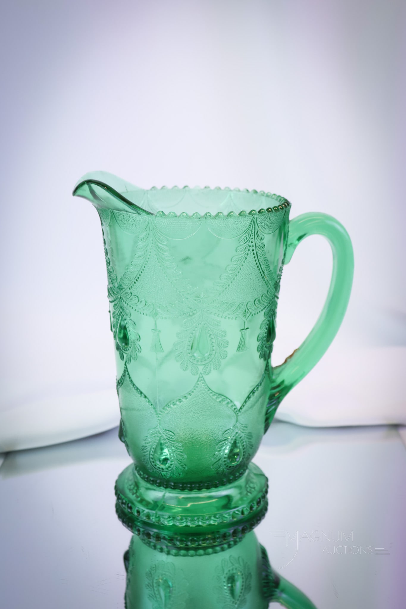 Greentown Victorian Glass Teardrop & Tassle water Pitcher: Take note of the beautiful coloring of this fine Teardrop & Tassle water pitcher by Greentown. This super example will make you green with envy if you don't win it. The pitcher measures 8 1/2" tall an