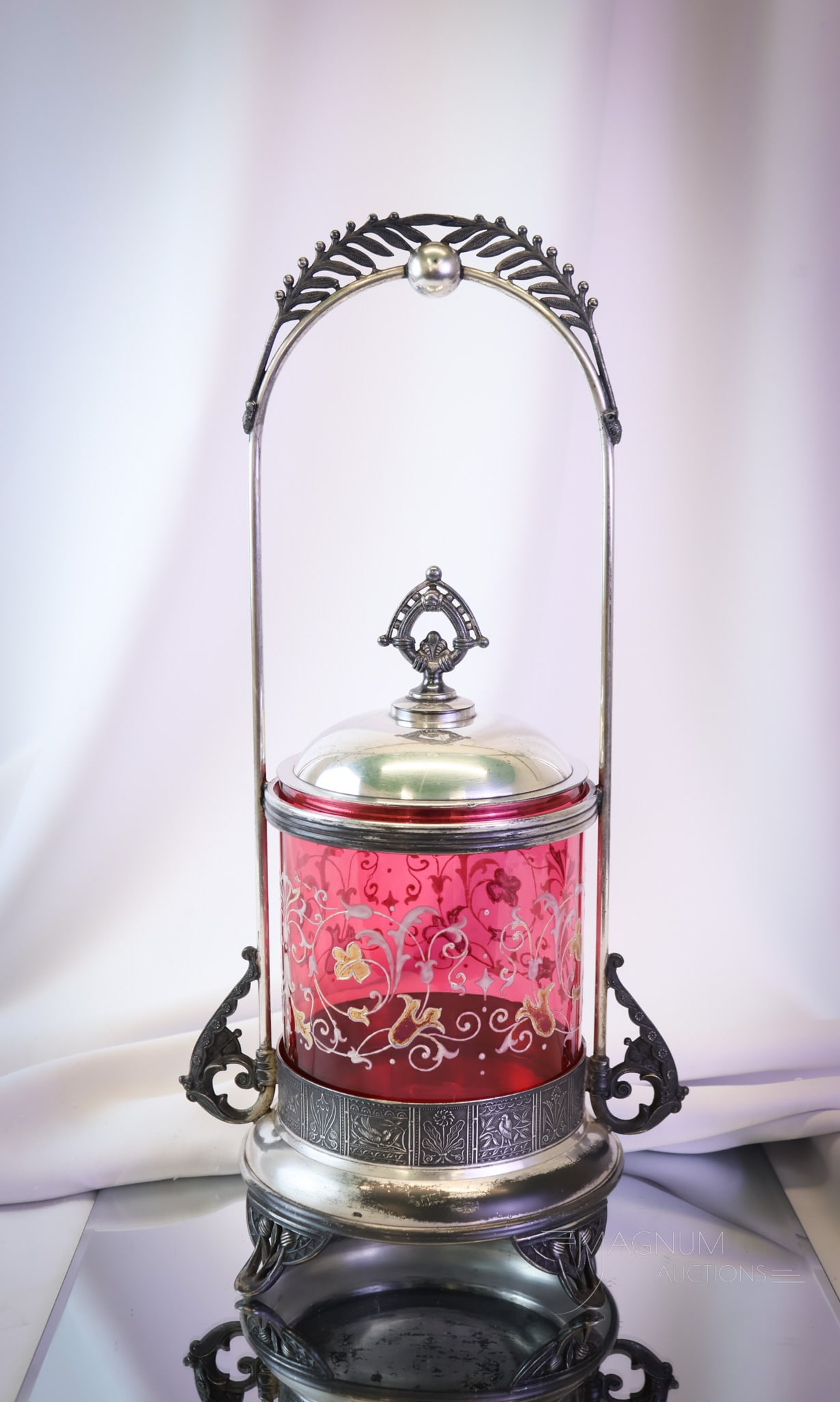 16" Pairpoint Silverplate Cranberry Enameled Glass Victorian Biscuit Jar: A beautiful and rare find in a piece of decorative Victorian silverplate and glass. This is a biscuit jar in cranberry enameled glass and complete in its original silverplate frame. This piece measure