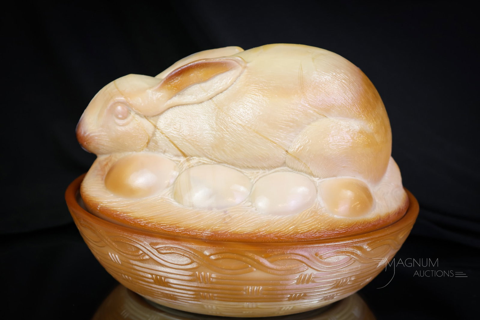 Fenton Chocolate Glass Rabbit on Nest: A whimsical and highly collectible Fenton rabbit on a Nest covered dish. This rabbit has beautiful chocolate coloring to the glass. This little bunny sits among eggs. The dish measures 5 1/2" tall. SH