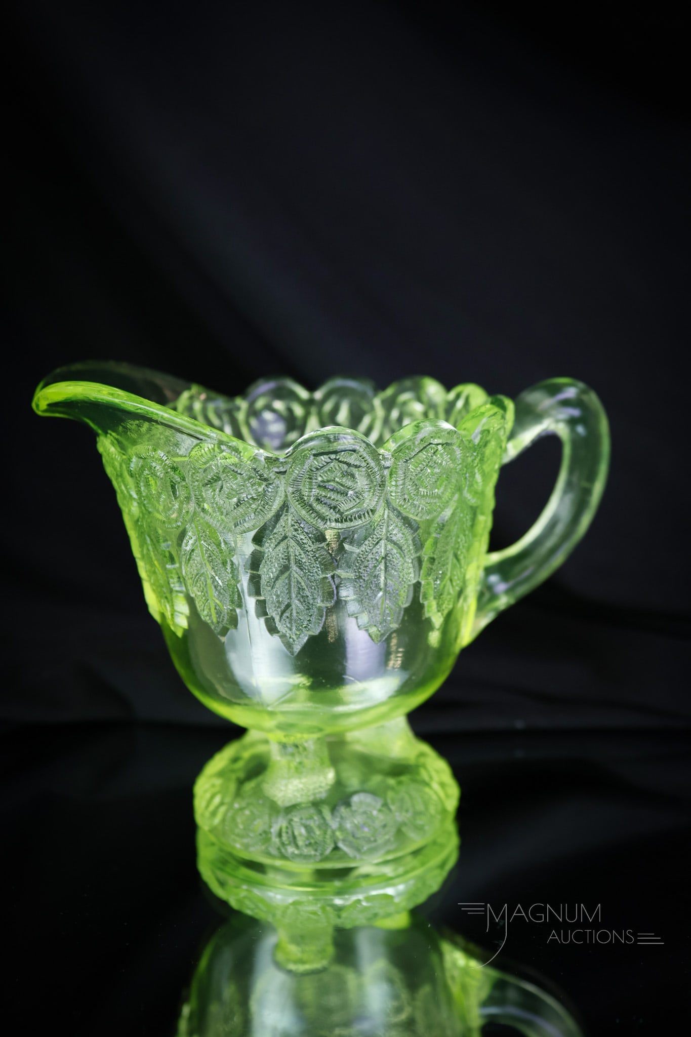 Vaseline Uranium Rose Garland McKee Victorian Creamer: Another select piece of Victorian McKee vaseline glass. This is a creamer in the Rose Garland pattern. This one lights up under black light for all of you shiners out there! This little gem measures 3