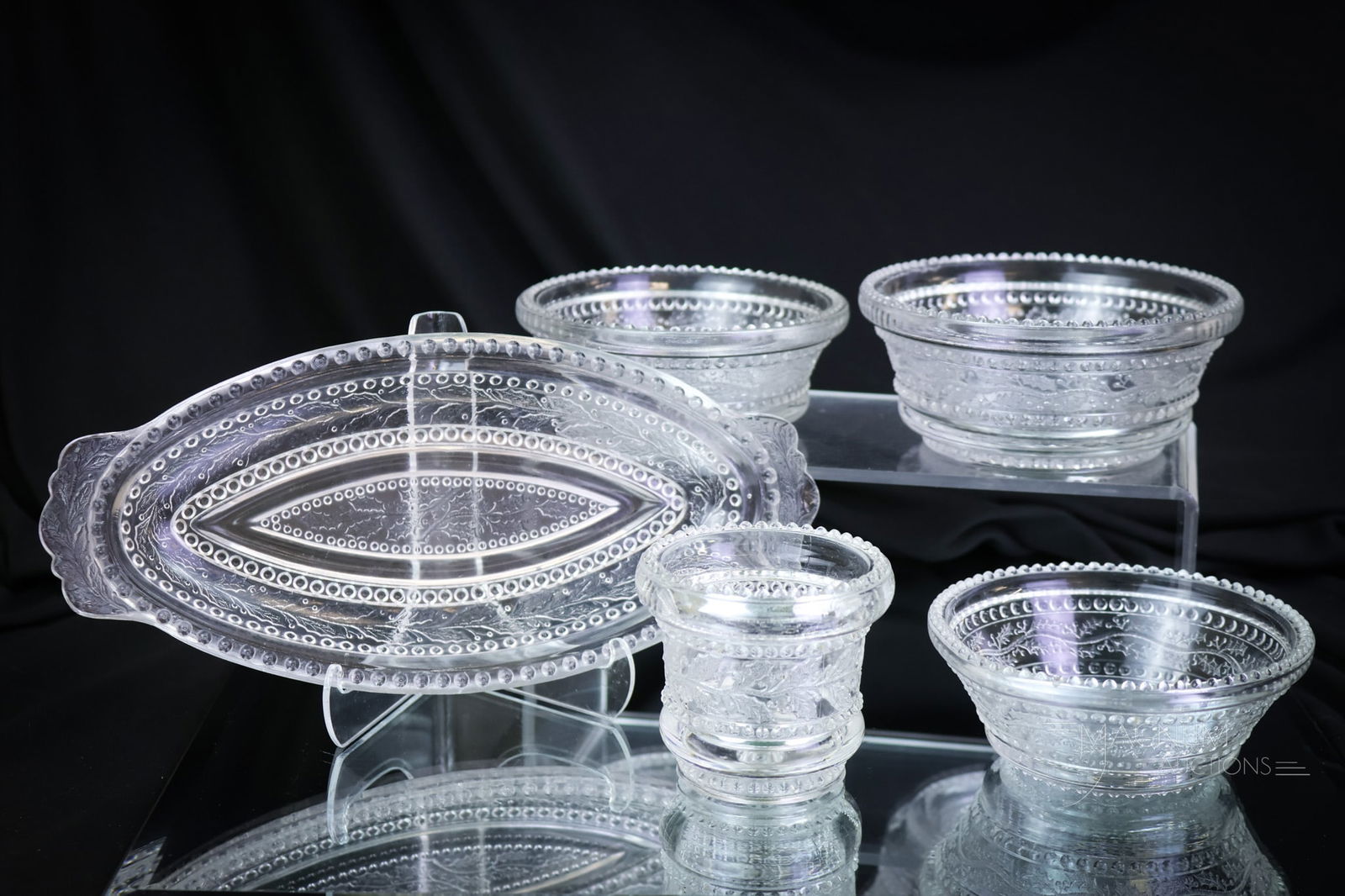 5 pc Lot Greentown Clear Holly Victorian Glass: A seductive lot of Greentown clear Holly pattern. This lot is made up by an oval dish two small berry bowls, a cereal bowl, and lastly a toothpick holder. The tallest of the lot measures 2". A chip to