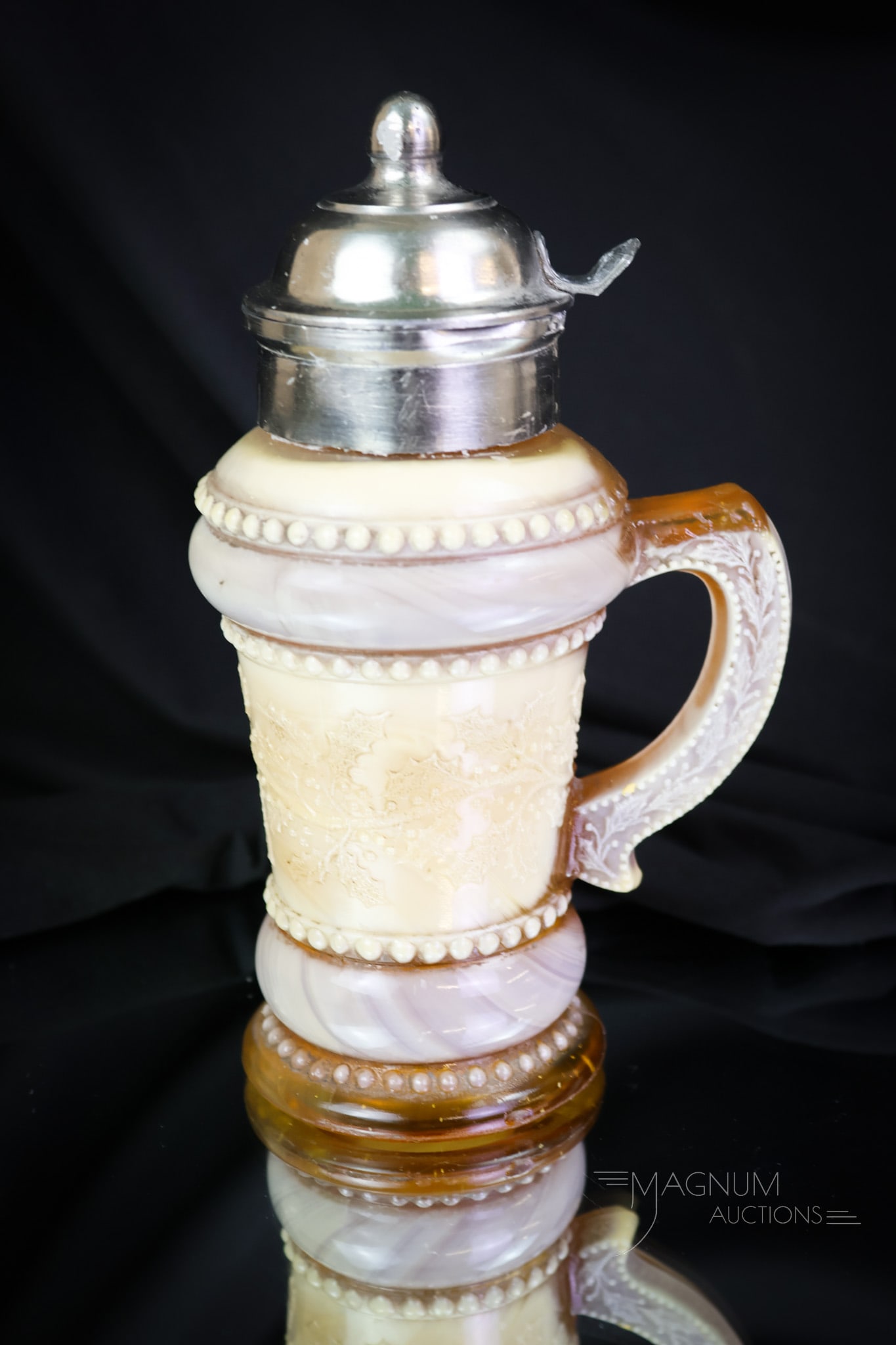 Greentown Holly Amber Victorian Glass Syrup Pitcher: A rare find, although this one has a chip on the shoulder. Many people do, so why shouldn't a syrup? This syrup is a nice example nonetheless. The syrup measures 6 1/2" tall. SHIPPING NOTICE: If you c