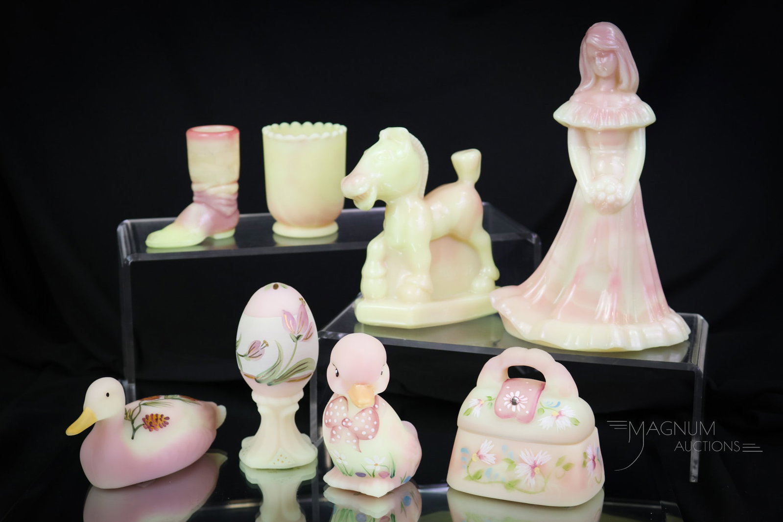 8 pc Lot Fenton Burmese Uranium Art Glass: The glowing delights abound here at Magnum Auctions. This lot is made up of eight fine and decorative figures, all made in uranium-rich burmese glass. The tallest measures 7". SHIPPING NOTICE: If you 