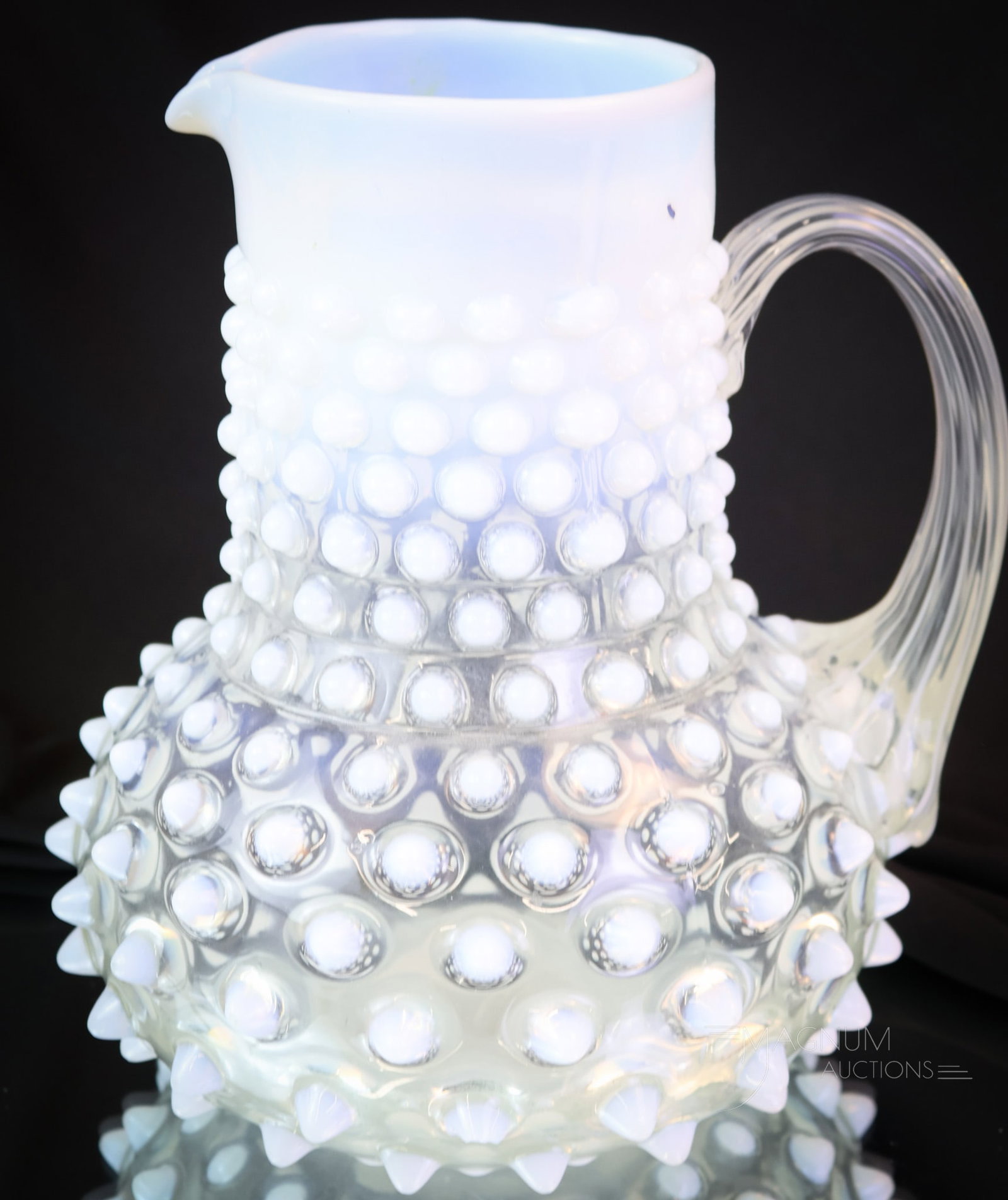 Phoenix Opalescent Victorian Glass Water Pitcher: A brilliant find in an attributed to Phoenix glass water pitcher. This super example exudes presence like no other pitcher could. This pitcher measures a full 8 1/4" tall. Chips to four hobs are noted