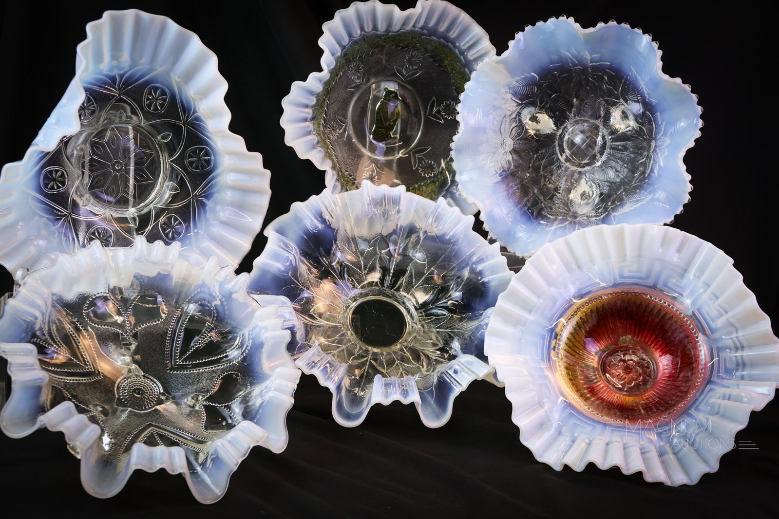 6 pc Lot Jolly Bear Poinsettia & More Opalescent Bowls: Six fine finds in Victorian opalescent bowls. This lot includes a Goofus decorated Jolly Bear, a Poinsettia, a Lattice, and more patterns. The tallest measures 4 1/2" tall. SHIPPING NOTICE: If you cho