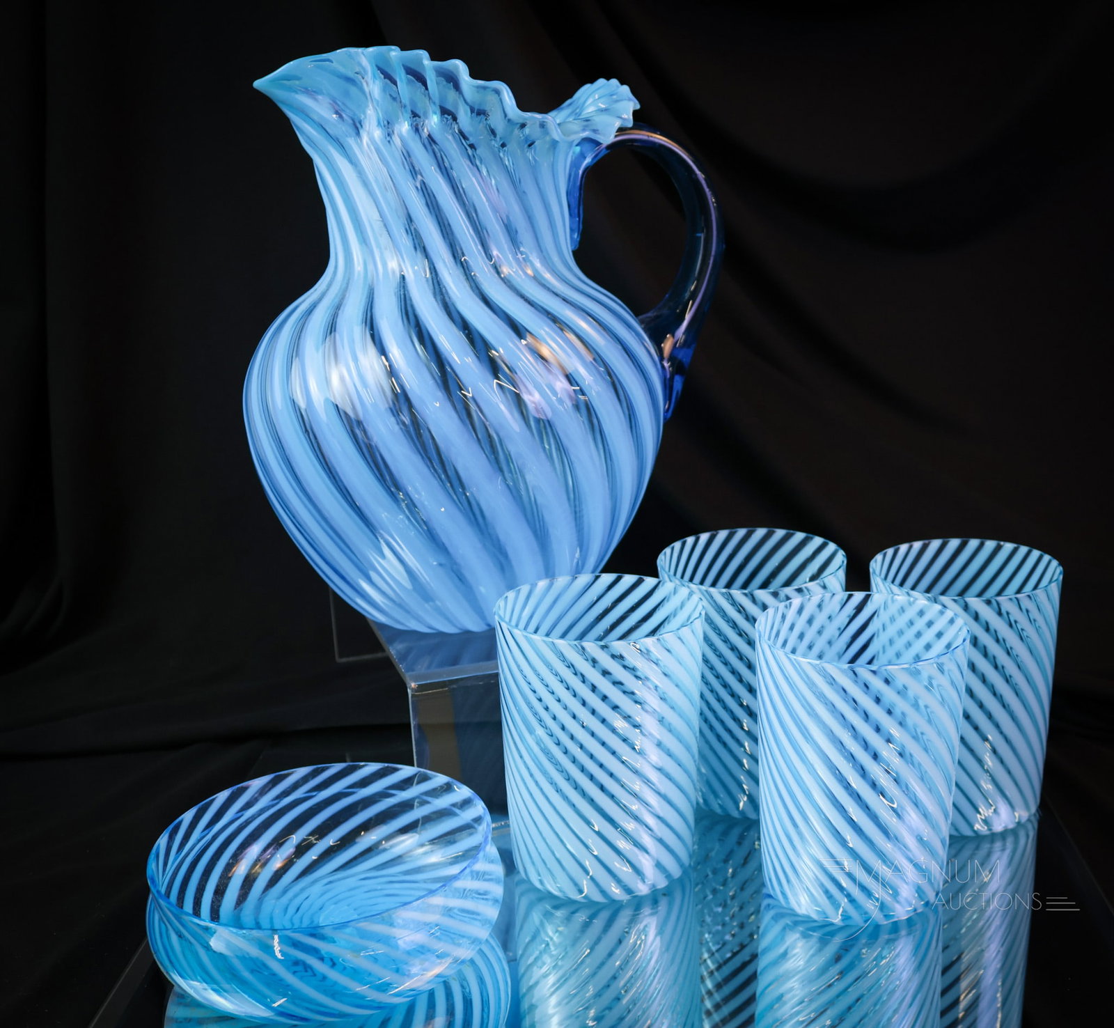 6 pc Lot Blue Opalescent Hobbs Victorian Glass Water Set & More: A striking water set and a little more in this offering. This lot is made up of a five-piece water set in blue opalescent Swirl pattern Hobbs glass. This, along with a small bowl. The tallest measures