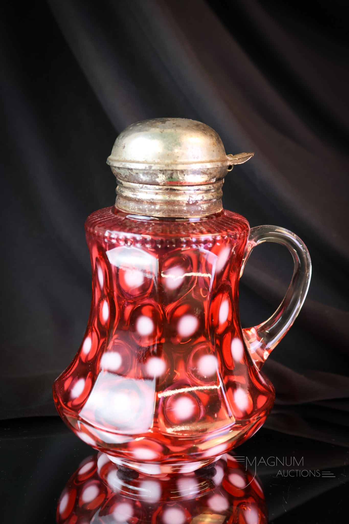 Rare Northwood Cranberry Opalescent Victorian Glass Syrup Pitcher: A lovely and rare find in a nine-panel mold syrup. This is a cranberry opalescent coinspot. A beautiful example with deep, rich coloring. The syrup measures 6" tall. SHIPPING NOTICE: If you choose not