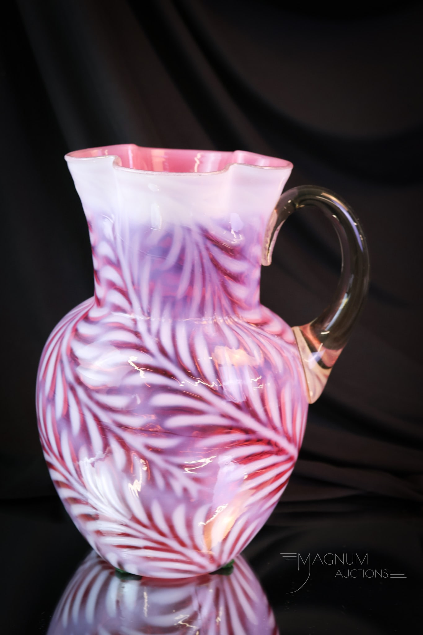 Cranberry Opalescent Victorian Glass Fern Water Pitcher: What a prime example this phenomenal pitcher is. This piece has a clover-shaped top rim. Beautiful color and opalescence makes this a must-have piece! The pitcher stands 9 1/2" tall. SHIPPING NOTICE: 