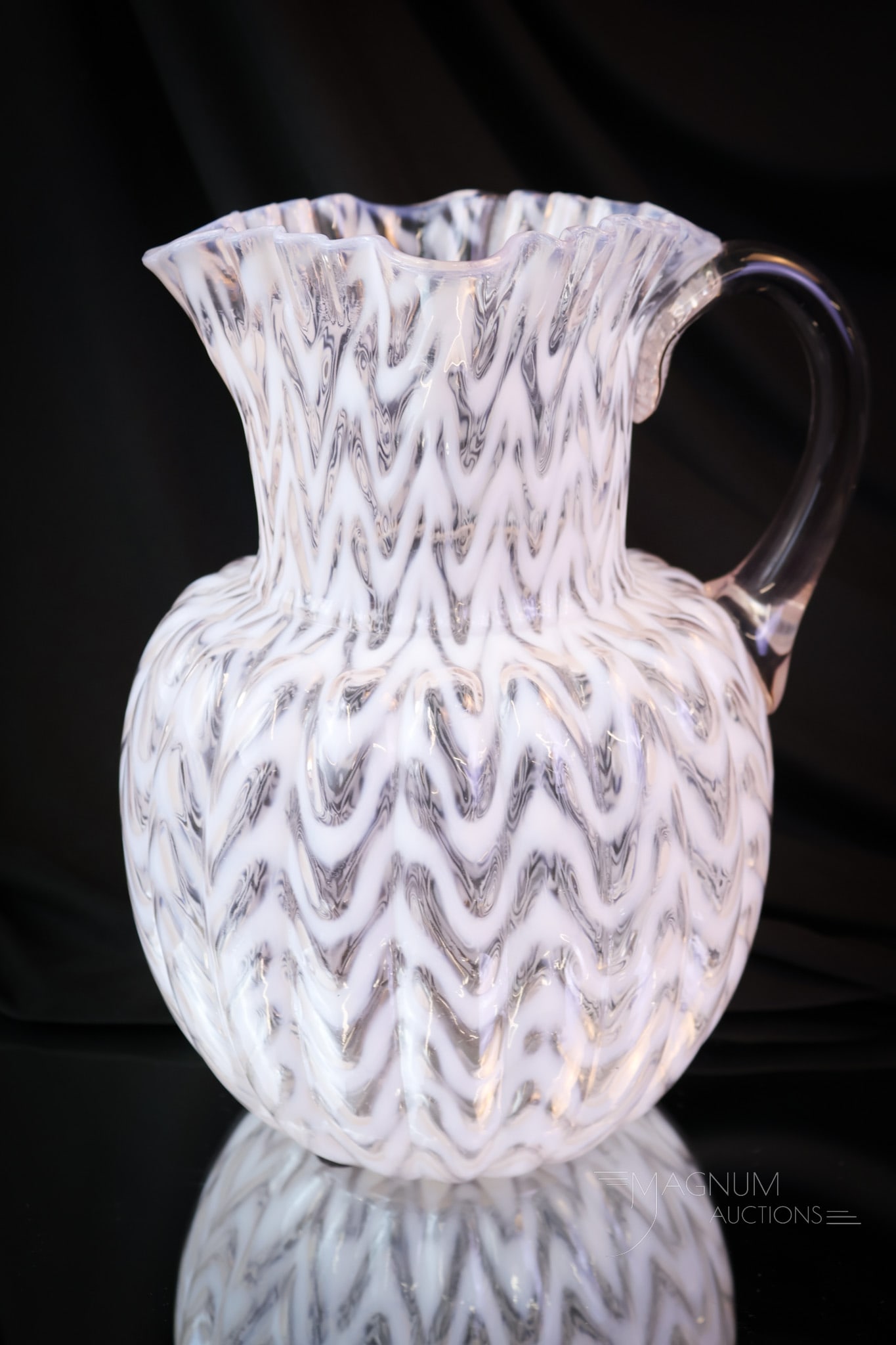 Rare Opalescent Melon Rib Herringbone Victorian Glass Pitcher: A rare find in a Victorian opalescent glass water pitcher. This pitcher is melon ribbed and has an opalescent Herringbone pattern covering the body. The pitcher measures 9 1/2" tall. SHIPPING NOTICE: 