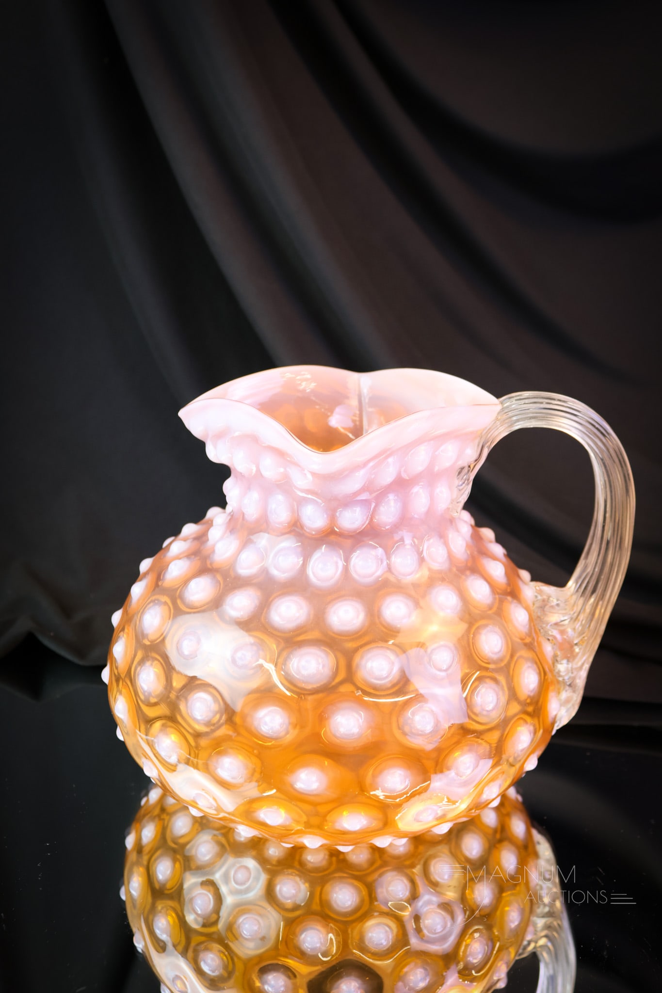 Rare Bittersweet Victorian Opalescent Hobnail Glass Pitcher: A very rare color to find this pitcher in. This bittersweet color is almost tangerine. With its bright white hobnails and applied handle, it’s a statement piece in any collection. The pitcher measur