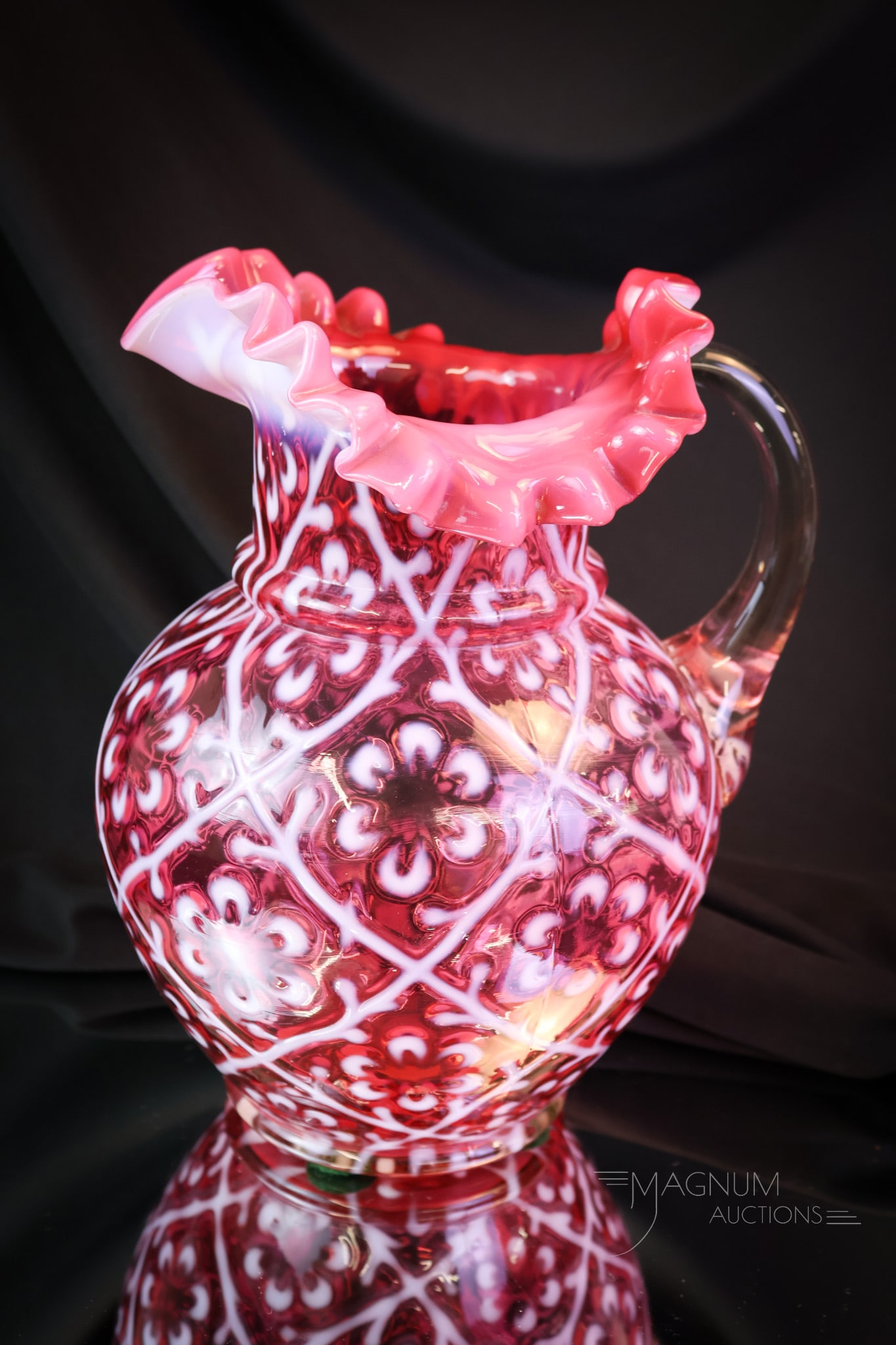 Rare Cranberry Opalescent Daisy in Criss Cross Victorian Glass Water Pitcher: This is a Mother Magnum favorite. This fine example is a rare find in cranberry opalescent. This has great form, color, and opal. Will you be the lucky new owner? The pitcher measures 9" tall and 7" w