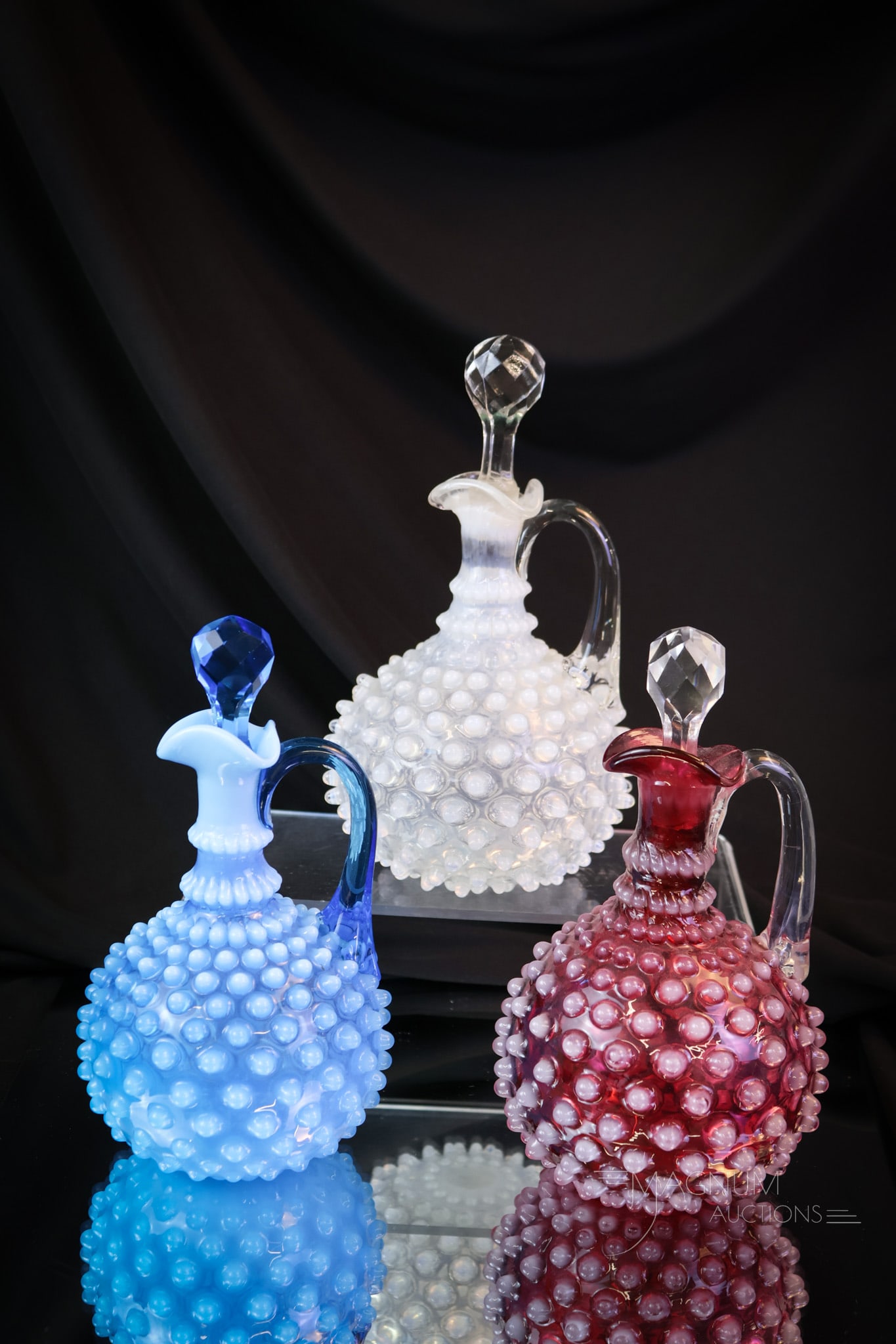 3 pc Lot Patriotism in Hobbs Hobnail Victorian Glass Cruets: We can always use a dose of patriotism. Look how pretty the three of these Hobbs cruets accent each other.Offered in this lot is a cranberry, blue and crystal opal examples. Each is a showpiece in its