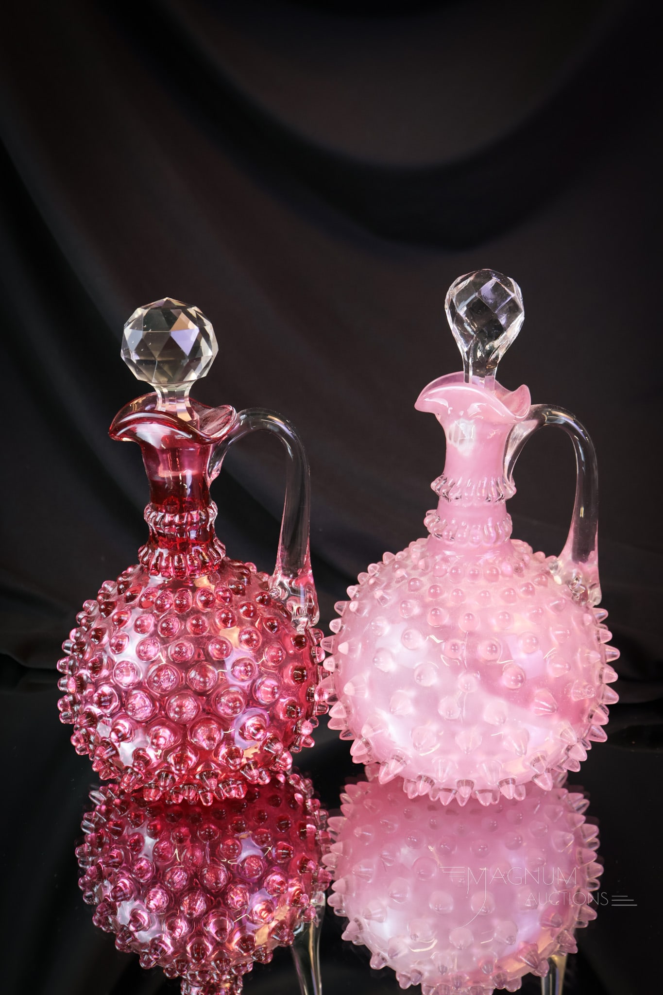 2 pc Lot Hobbs Victorian Glass Hobnail Cruets Rose & Cranberry: Two of the classic Hobbs pattern cruets together in one lot. This lot combines a cranberry along with a rose-cased example. Which one is prettier? Just buy both. You know you love both of them! The ta