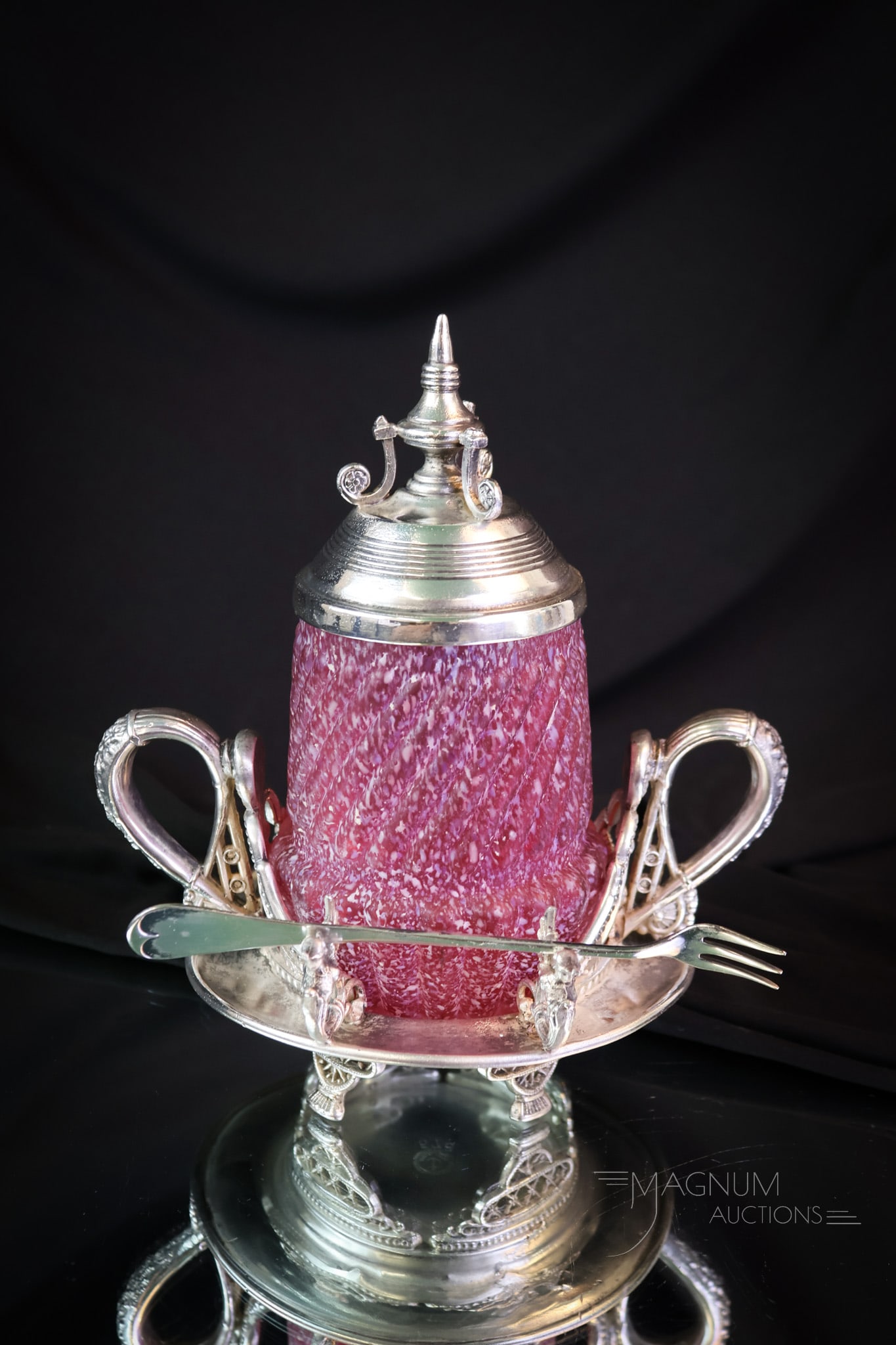 Anchor Silverplate Northwood Cranberry Victorian Pickle Castor: Here's a find! This is a Victorian pickle castor in cranberry frit glass. The frame is signed Anchor silverplate. The jar is by Northwood and is in the Chrysanthemum Base Swirl pattern in their frit f