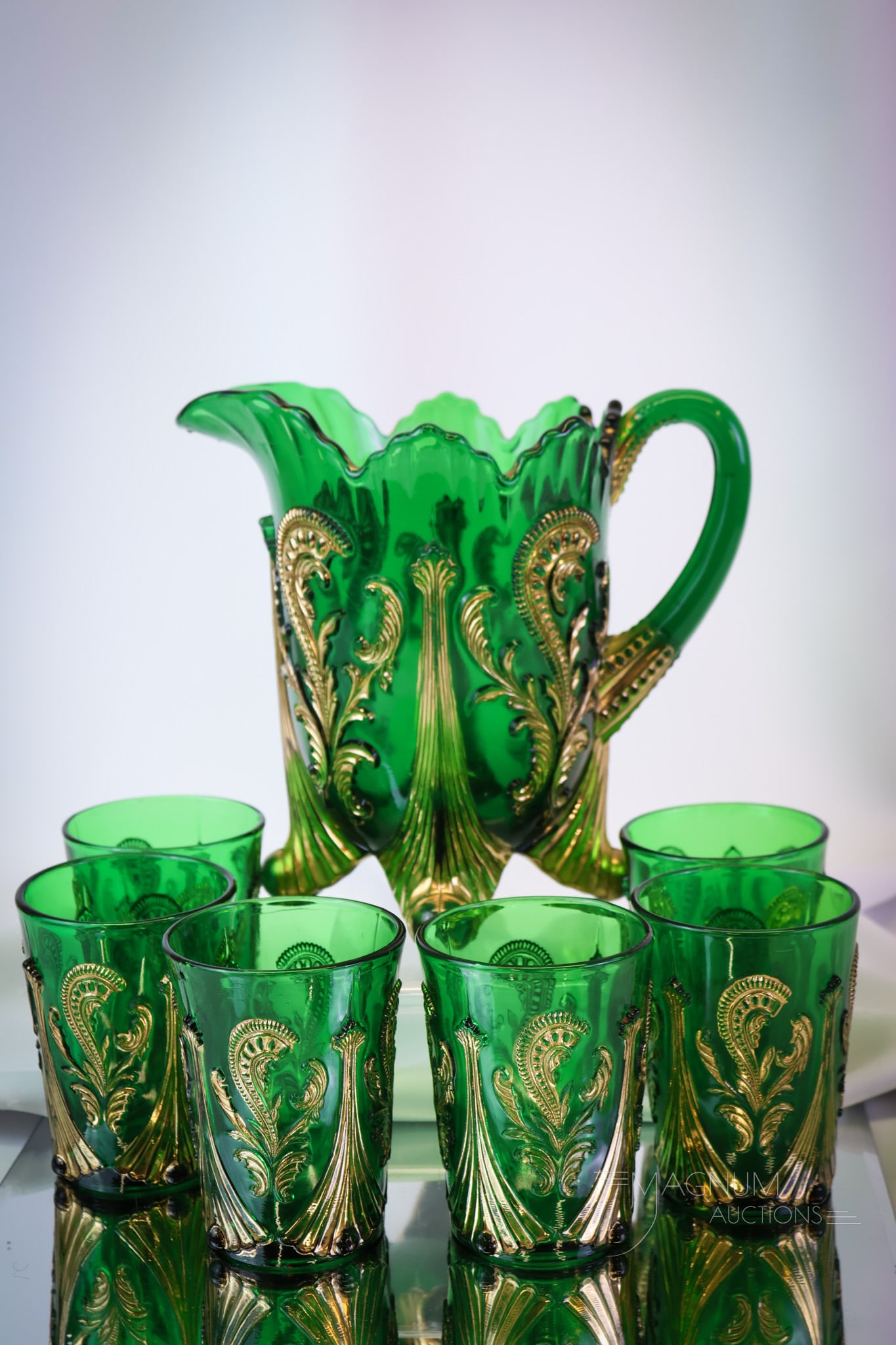 7 pc Set Northwood Inverted Fan & Feather Victorian Glass Water Set: A great complete set of Northwood's Inverted Fan & Feather pattern. This set is in rich emerald green with gold decoration. The set features a pitcher and six tumblers. The tallest measures 8". SHIPPI