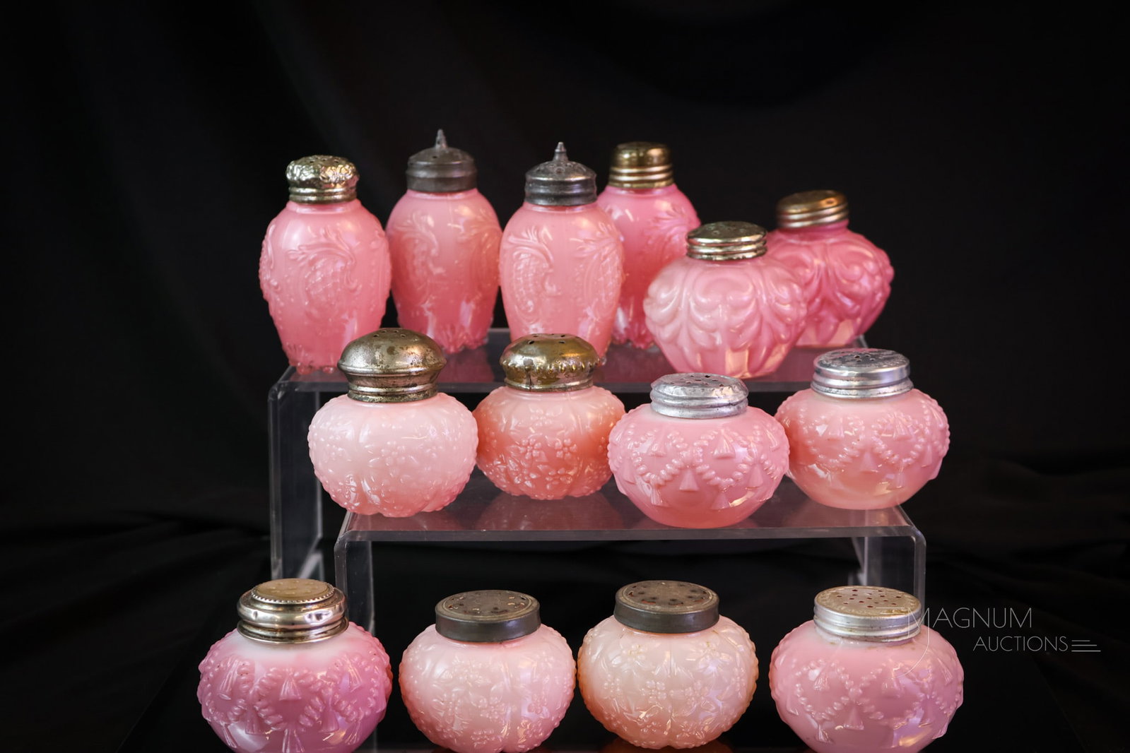 14 pc Lot Victorian Pink Opaque Victorian Glass Salt Shakers: Seven matched pairs are present in this plentiful lot of Victorian pink opaque glass salt shakers. Each a nice and pretty in pink example. The tallest measures 3". Makers such as Consolidated and Chal