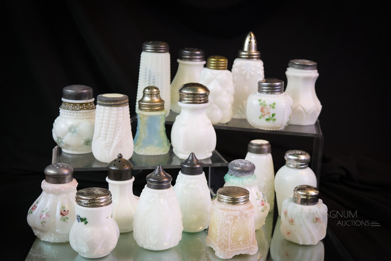 19 pc Lot Victorian Milk Glass Salt Shakers Decorated Corn & More: Nineteen fine milk glass decorated and more Victorian glass salt shakers. Some very unique pieces. Make way on the shelf for these gems. The tallest measures 4 1/2". SHIPPING NOTICE: If you choose not