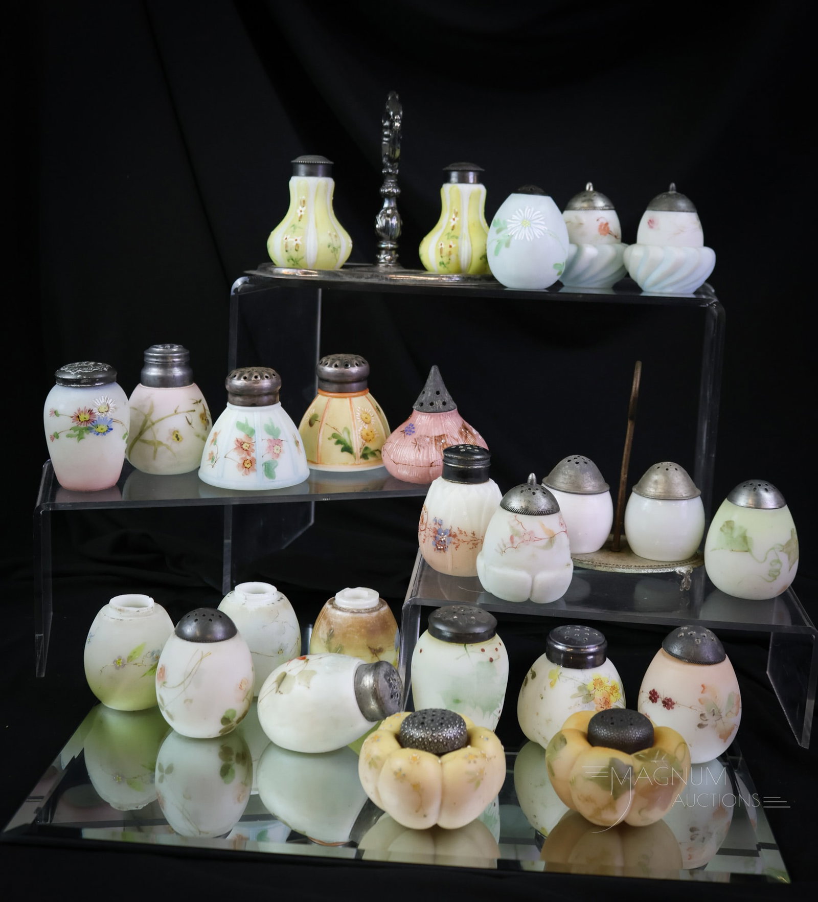 25 pc Mt. Washington Glass & More Victorian Salt Shakers: Twenty five delights to bid on in this lot. This lot offers a variety of Mt. Washington and similar Victorian glass salt shakers. Each a beautiful piece of an era gone by. The tallest measures 3". SHI