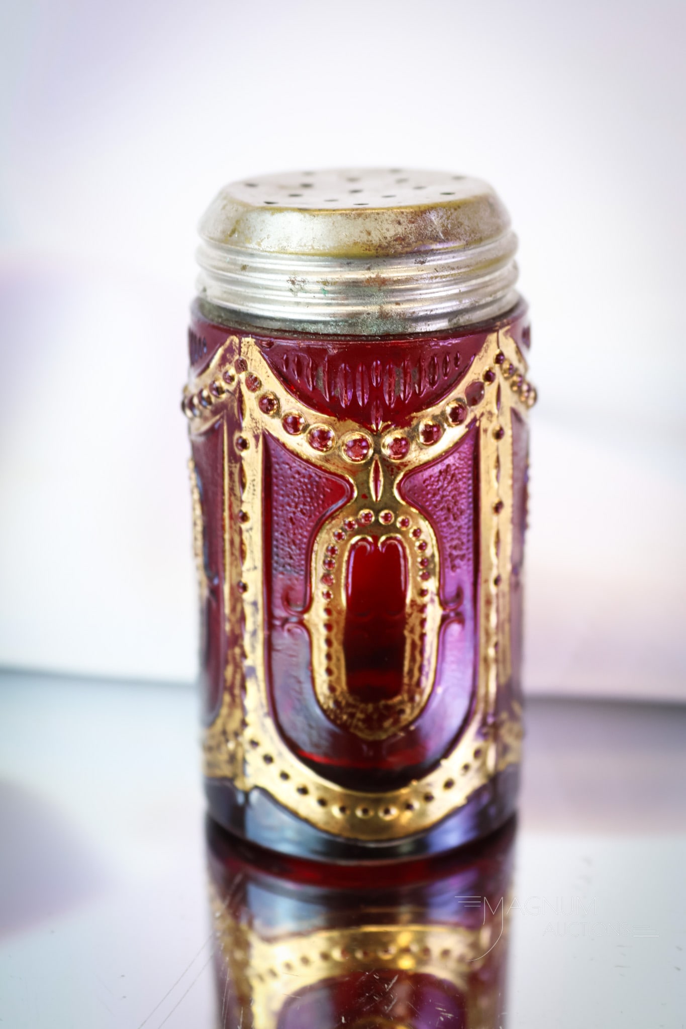 Heisey Ruby Stained Locket on Chain Victorian Glass Salt Shaker: A shining example of a rare Victorian pattern glass shaker by Heisey. This is a ruby stained Locket on Chain pattern salt. Great coloring and brilliant gold makes this elusive shaker a must-have piece