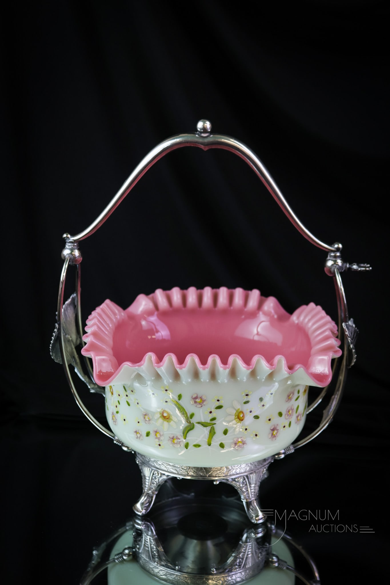 Derby Silverplate Enameled Uranium Custard Glass Victorian Brides' Basket: A wonderful glowing piece of Victorian uranium-rich art glass. This is brides' bowl frame features leaves and is signed Derby silverplate. The bowl is a rich custard glass exterior and and a peachblow