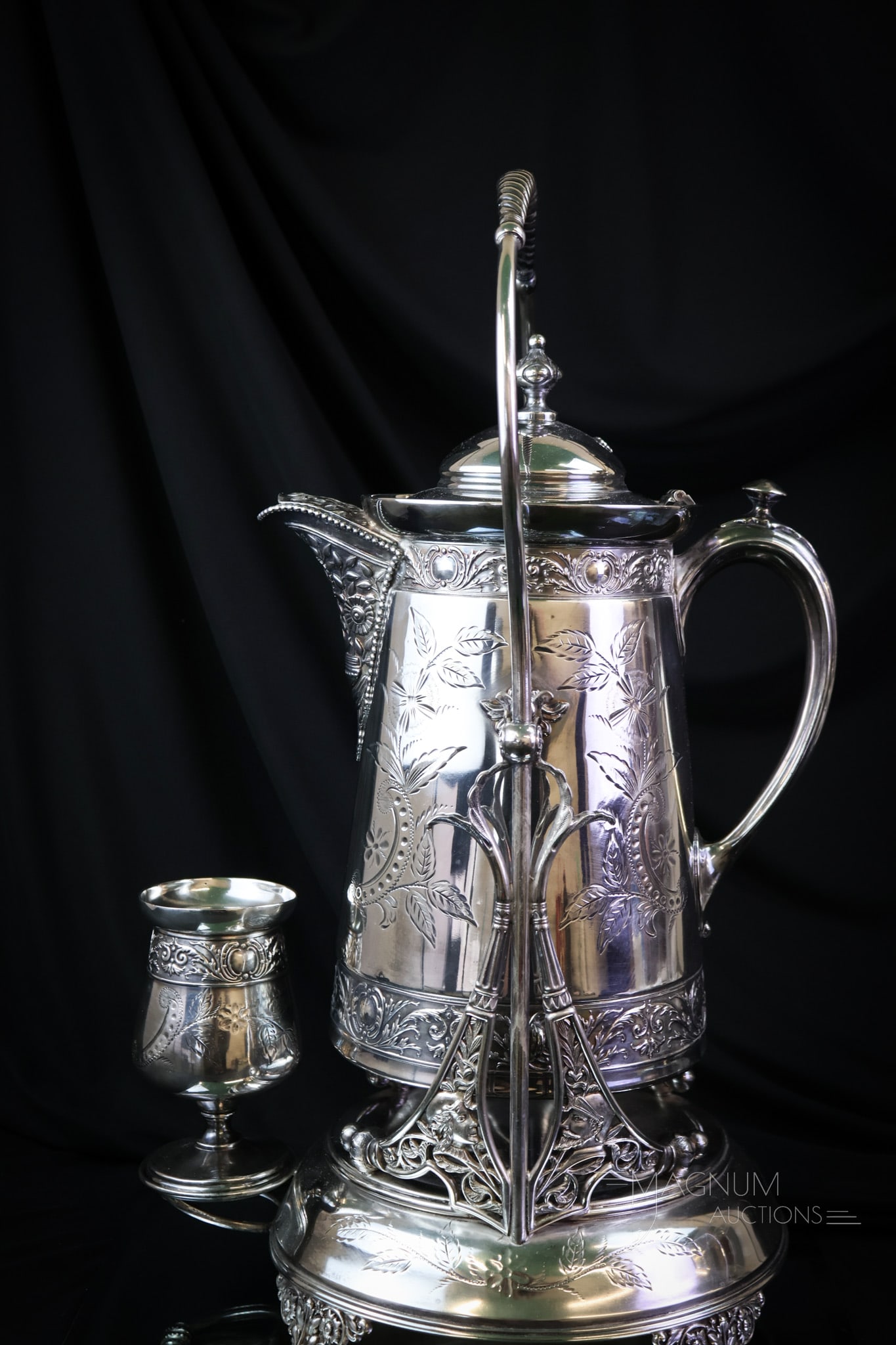 Meriden Victorian Silverplate Water Set Tipler: A beautiful Victorian silverplate piece. This tipler measures a full 19 1/2" tall. It is complete with matching goblet. It is embossed and chased. Imagine the old home this must have graced! SHIPPING