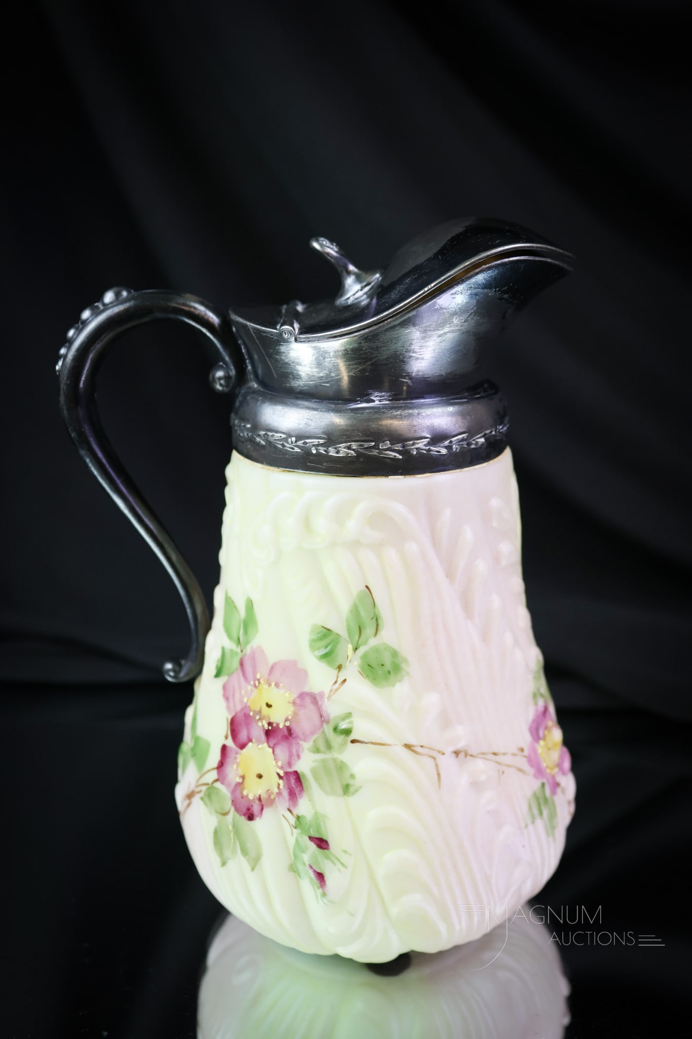 PairpointVictorian Decorated Glass Syrup Pitcher: A lovely find in a decorated Pairpoint Victorian syrup pitcher. This one has embossed scrolling, as do similar boxes by Pairpoint. It is decorated with florals and numbered on the base. The syrup meas