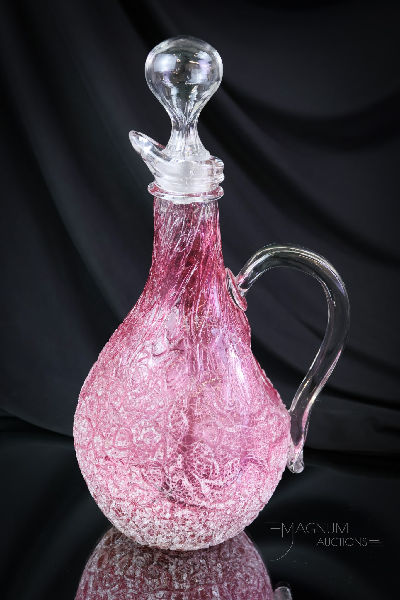 Cranberry Victorian Overshot Arabesque Glass Ice Bladder Claret Pitcher: A gorgeous and seldom-found piece. This is an ice bladdered claret in Victorian cranberry overshot glass. This fine find measures 12" tall and 6 1/4" wide. SHIPPING NOTICE: If you choose not to utiliz