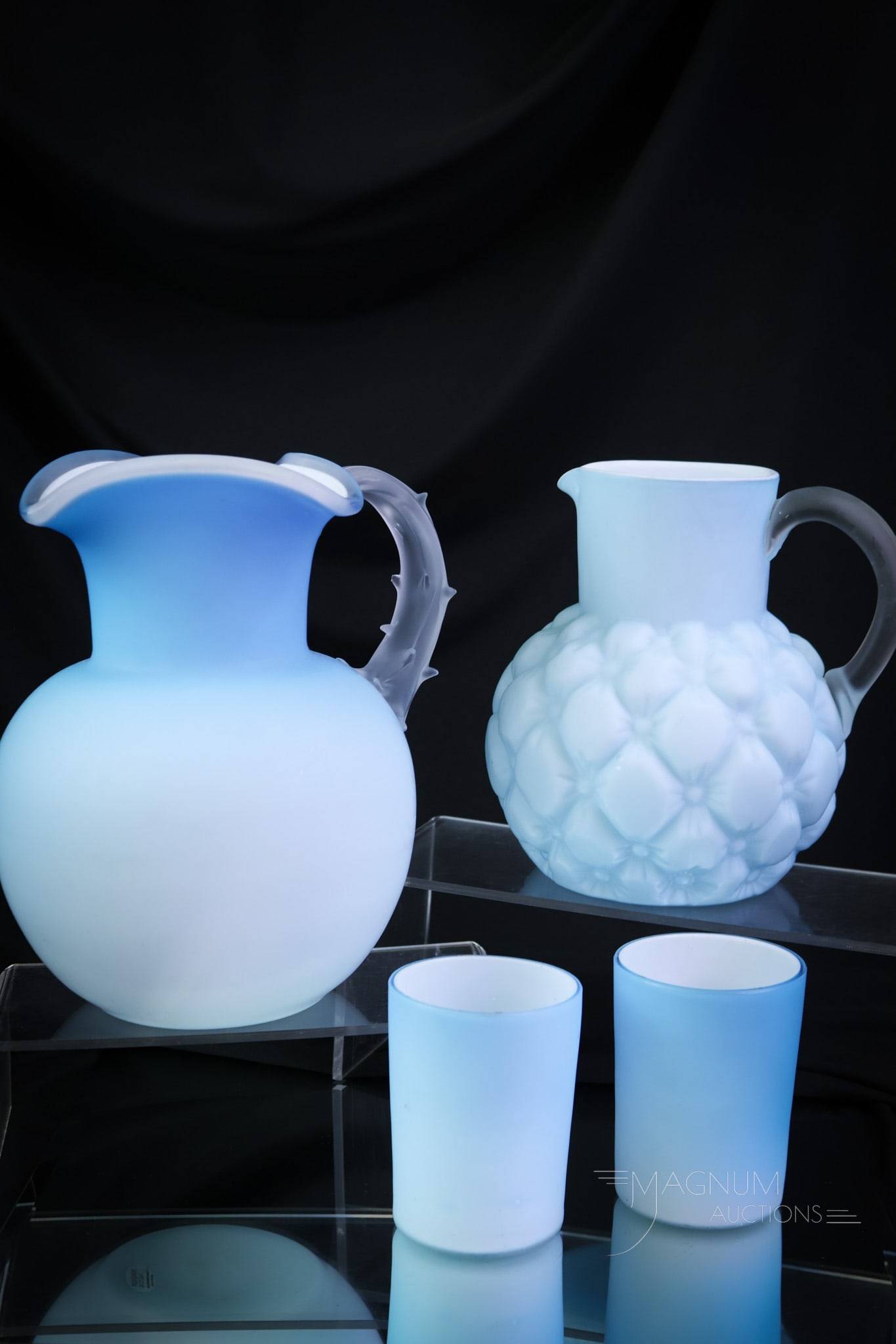 4 pc Lot Silky Satin Goodness in Victorian Glass: This lot has so much to offer and yet. The lot includes a blue water pitcher with an applied thorn handle. Two tumblers match this pitcher. The fourth piece is a quilted example in the same silky smoo