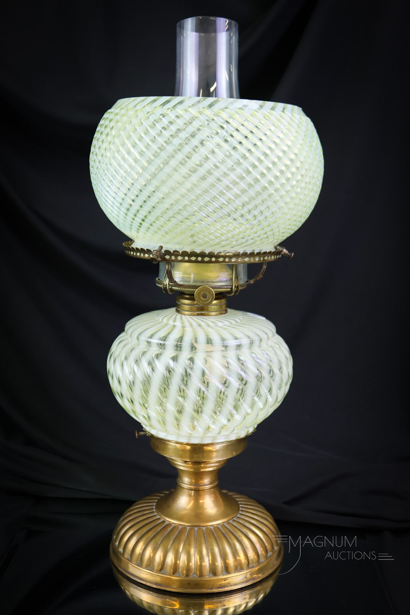 Rare Vaseline Uranium Opalescent Reverse Swirl Victorian Oil Table lamp: A rare find in a Victorian glass oil lamp. This lamp is in the Reverse Swirl pattern and in uranium-rich vaseline glass. This baby lights up under black light. The Vasies and Uranies will be duking it