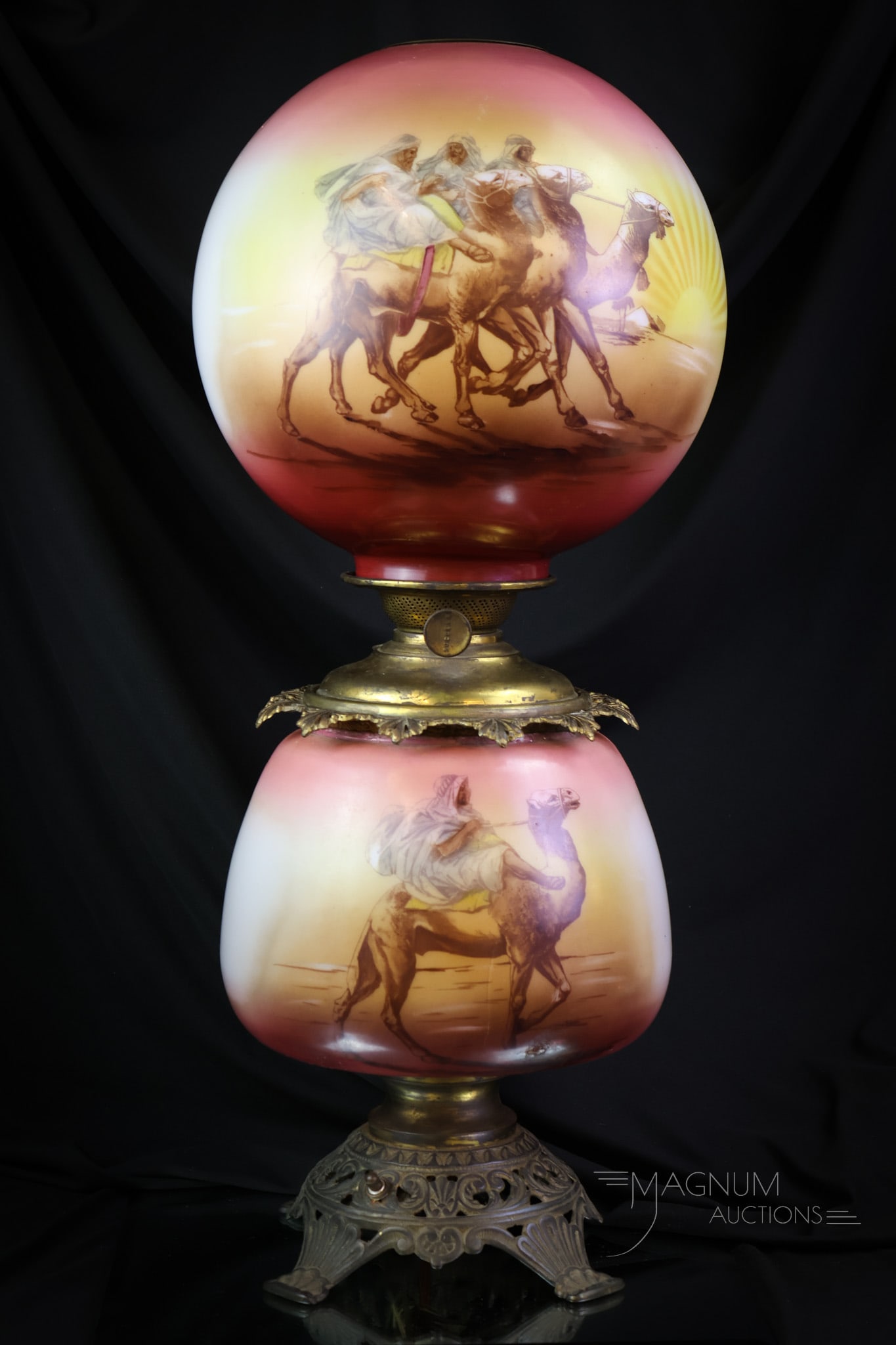 Victorian Arab Desert Scene Victorian Gone with the Wind Oil Lamp: A very nice Victorian Arab camel and desert scene decorated Gone with the Wind oil lamp. The lamp has been electrified. This decoration is seldom seen and quite scarce. The lamp measures 25" tall. SHI