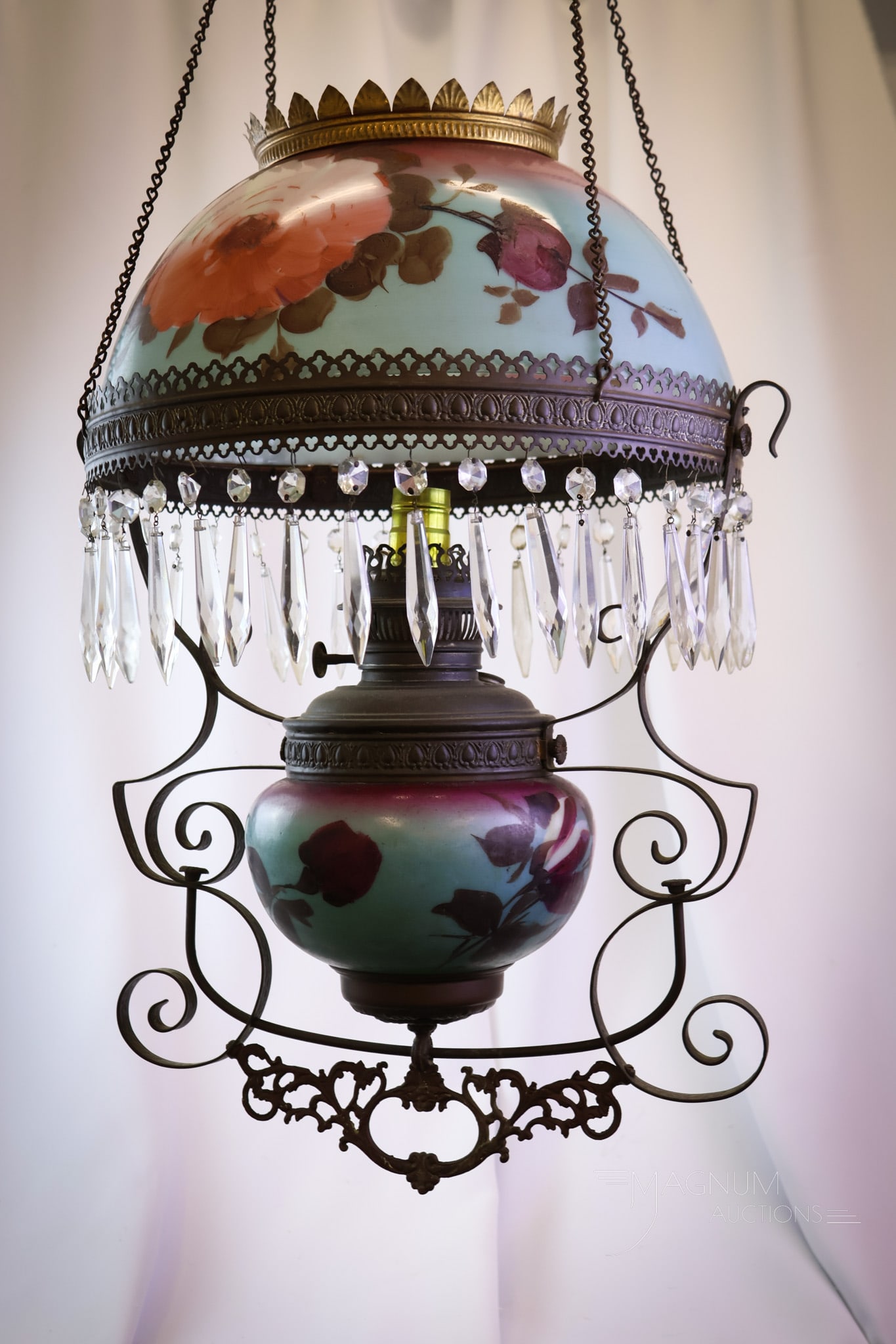 Victorian Hanging Hand Painted Roses Parlor Oil Lamp: Here's a pretty lamp! This Victorian hanging parlor lamp features a hand-painted shade of garden roses on opal glass. The lamp has been electrified but retains the original motor. The lamp measures 39