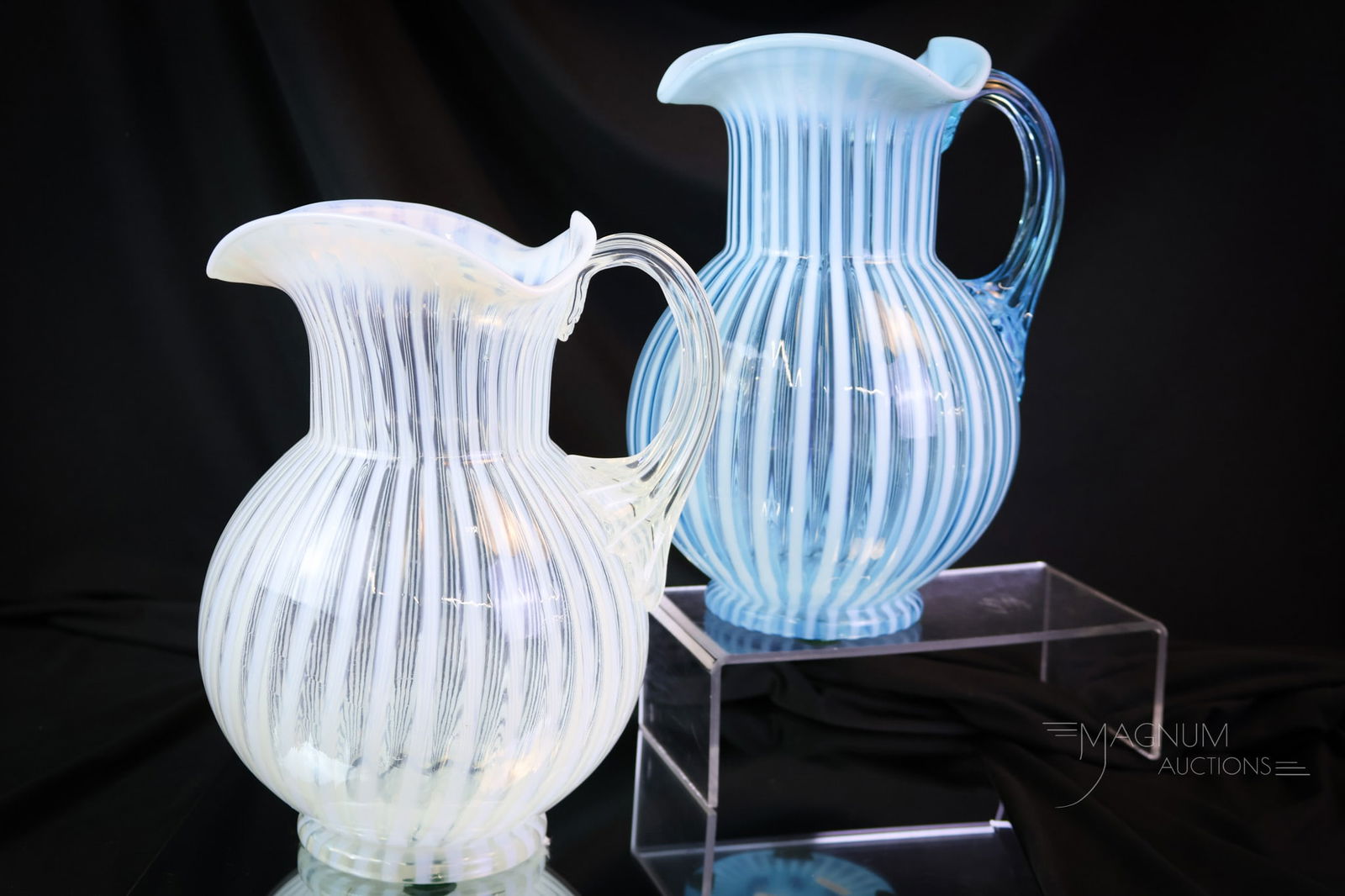 2 pc Lot Victorian Albany Stripe Opalescent Glass Water Pitchers: Two stunning examples of Victorian opalescent Albany glass Stripe pattern water pitchers. One in brilliant blue opalescent. One in white opal on crystal. Each pitcher has excellent clarity and color.