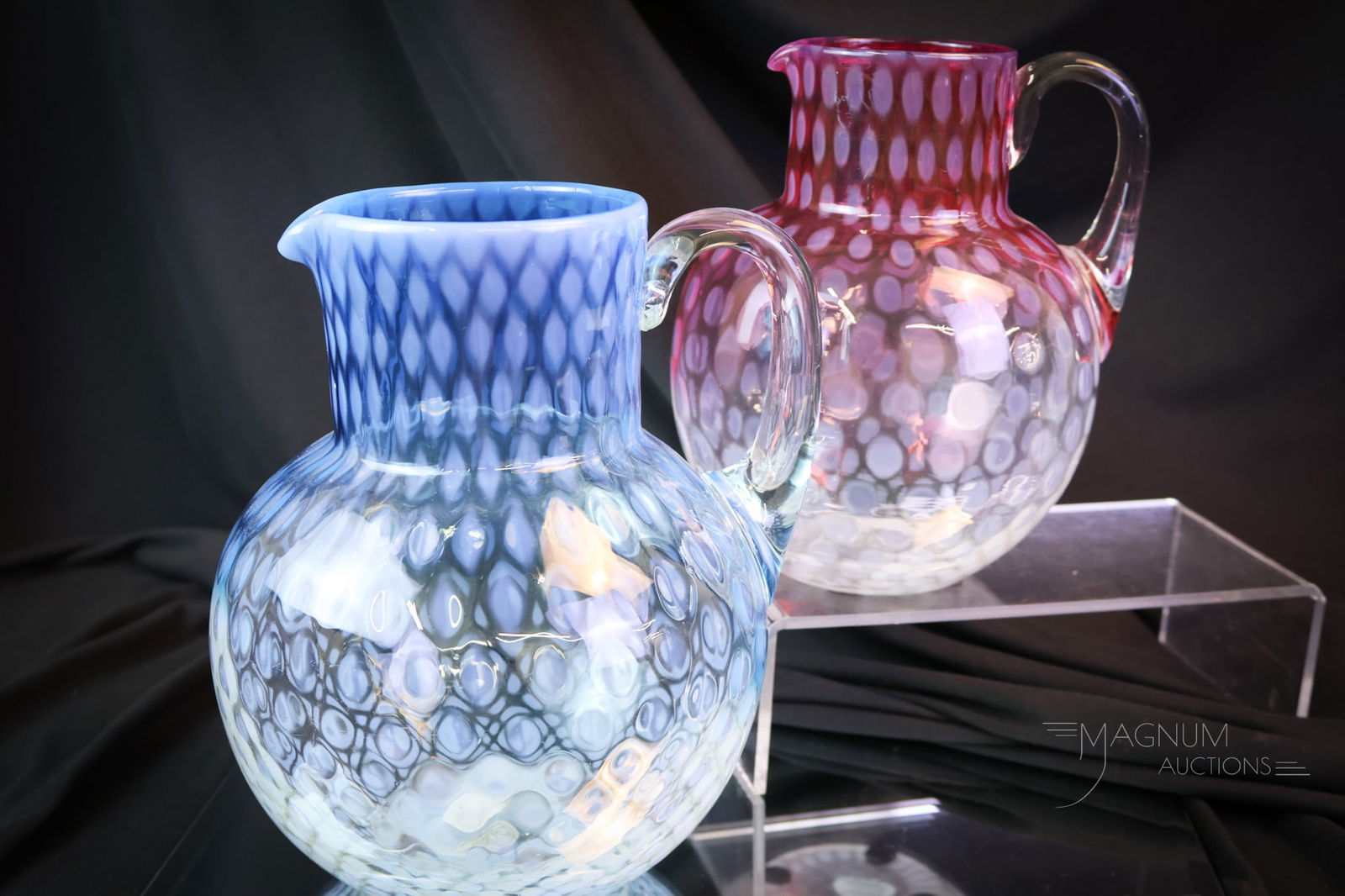 2 pc Lot Victorian Phoenix Opalescent Glass Water Pitchers Cranberry Rubina & Blue: Two matching finds in Victorian attributed to Phoenix glass water pitchers. Both of these are ball-shaped. One is in cranberry rubina opal, and the other is in blue die-away opal. Both are in the Baby