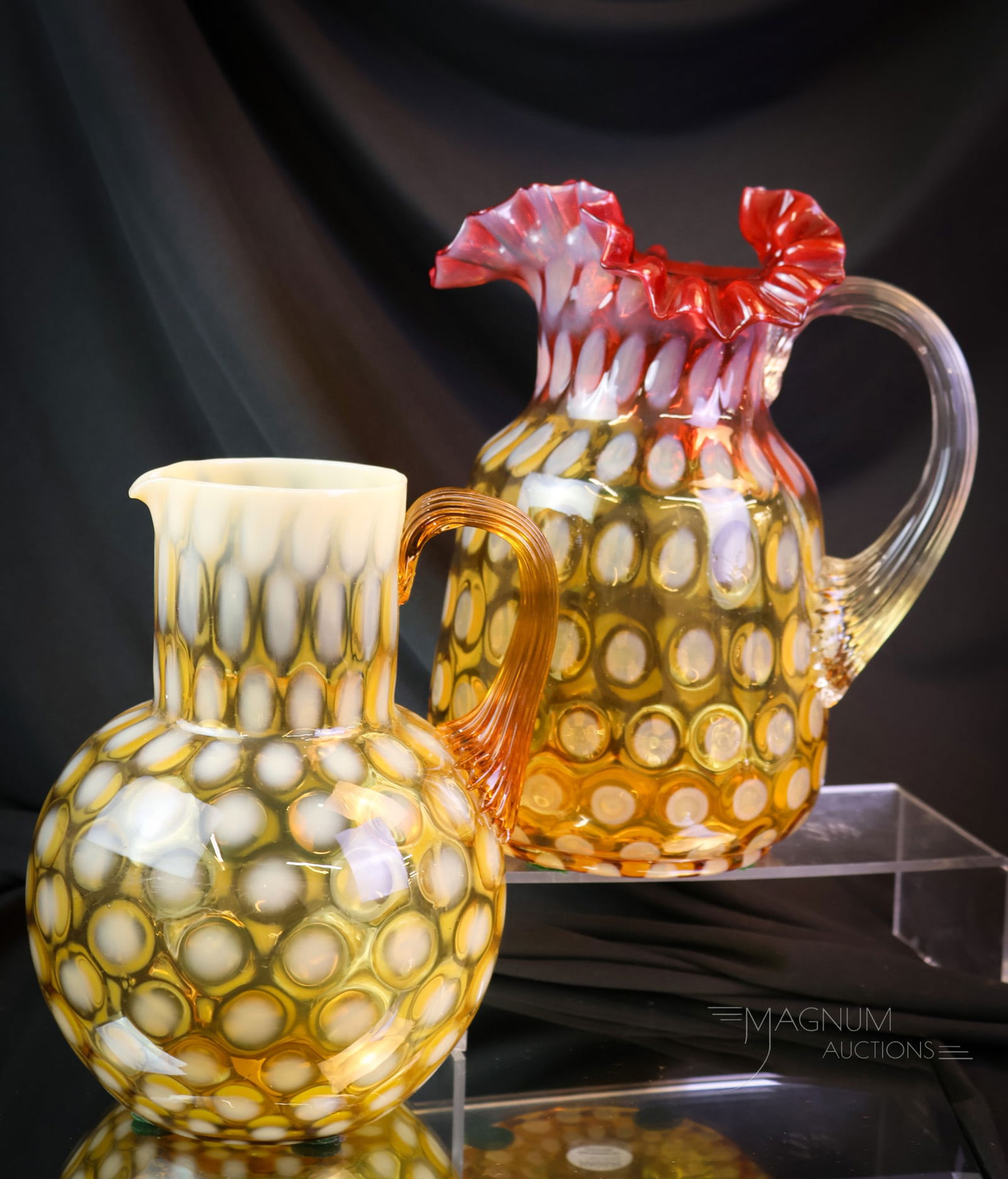 2 pc Lot Victorian Phoenix Glass Opalescent Water Pitchers Amberina & Amber: two incredible examples of attributed to Phoenix glass Victorian water pitchers in the Coinspot pattern. One in amber opal. The other is in Amberina opal. The tallest of the two pitchers measures 8 1/