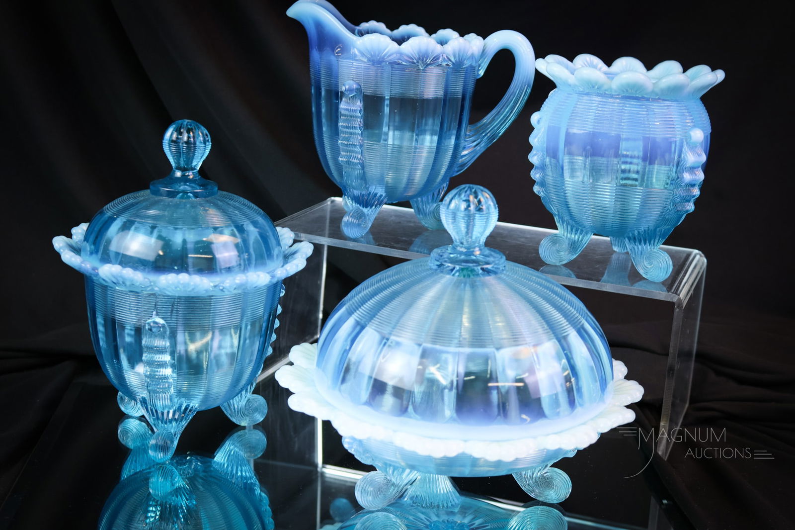 4 pc Set Northwood Blue Opalescent Jackson Klondyke Pattern Glass: A wonderful and complete four-piece table set in the Northwood Jackson or Klondyke pattern. Brilliant color and perfect opal even adds to the drama of this set. The tallest measures 7". SHIPPING NOTIC