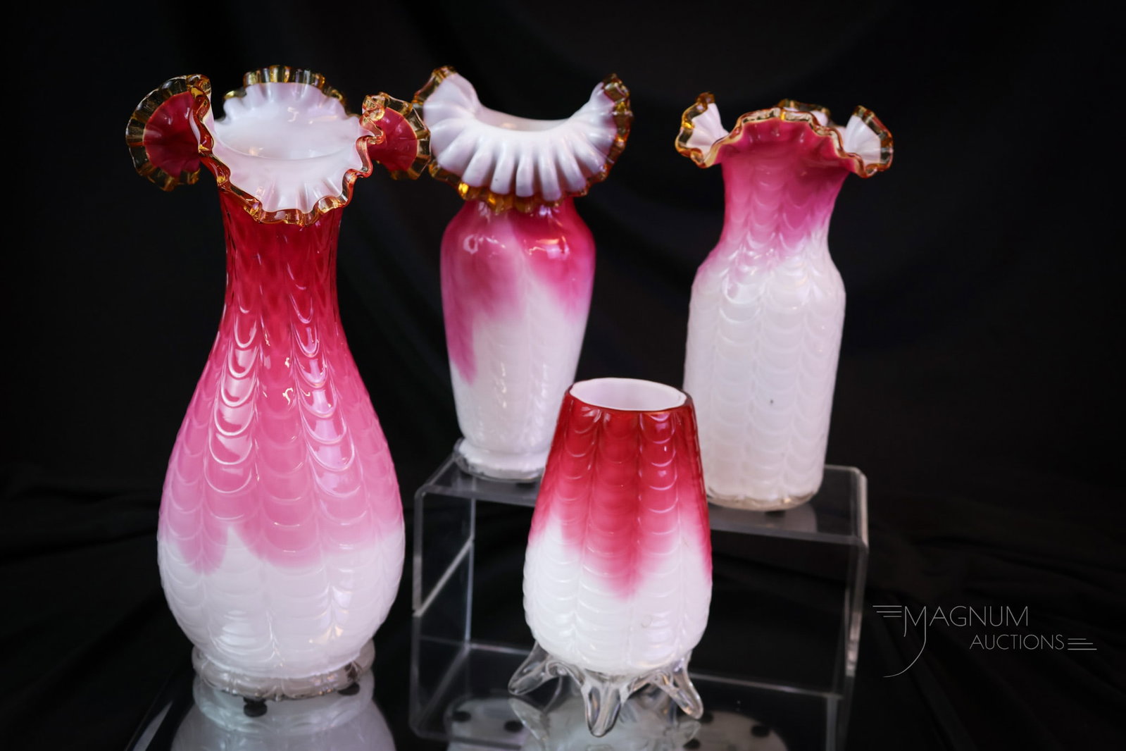 4 pc Lot Phoenix Drapery Victorian Glass Vases: A diverse array of Victorian glass vases that are attributed to Phoenix Glass. These are made in pink to white cased glass in a drapery pattern. The tallest of the lot measures 10". SHIPPING NOTICE: I