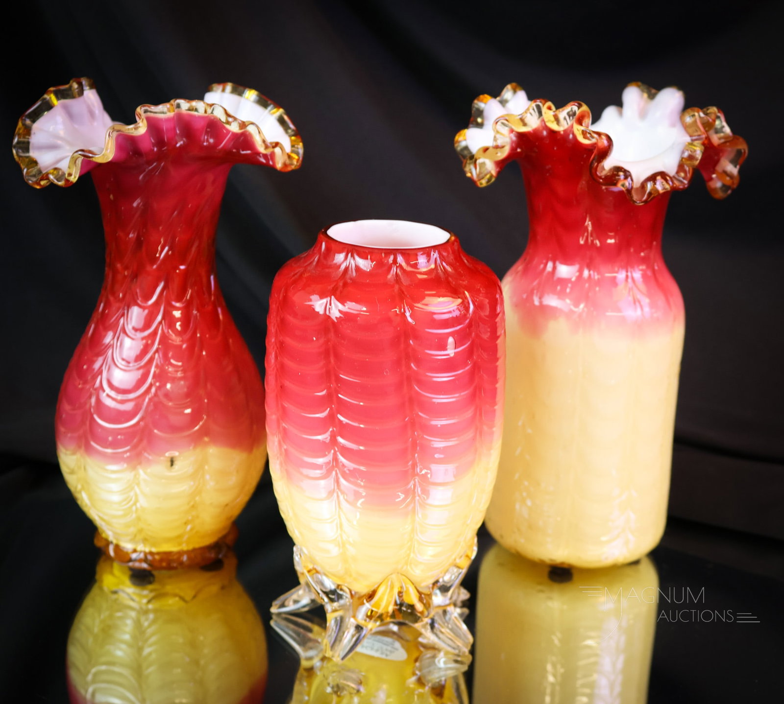 3 pc Lot Phoenix Drape Cased Victorian Peachblow Glass Vases: Three delights in Victorian peachblow glass. These are attributed to Phoenix Glass. This assortment of vases is in an array of forms. One even has applied feet. The tallest of the lot measures 7". The