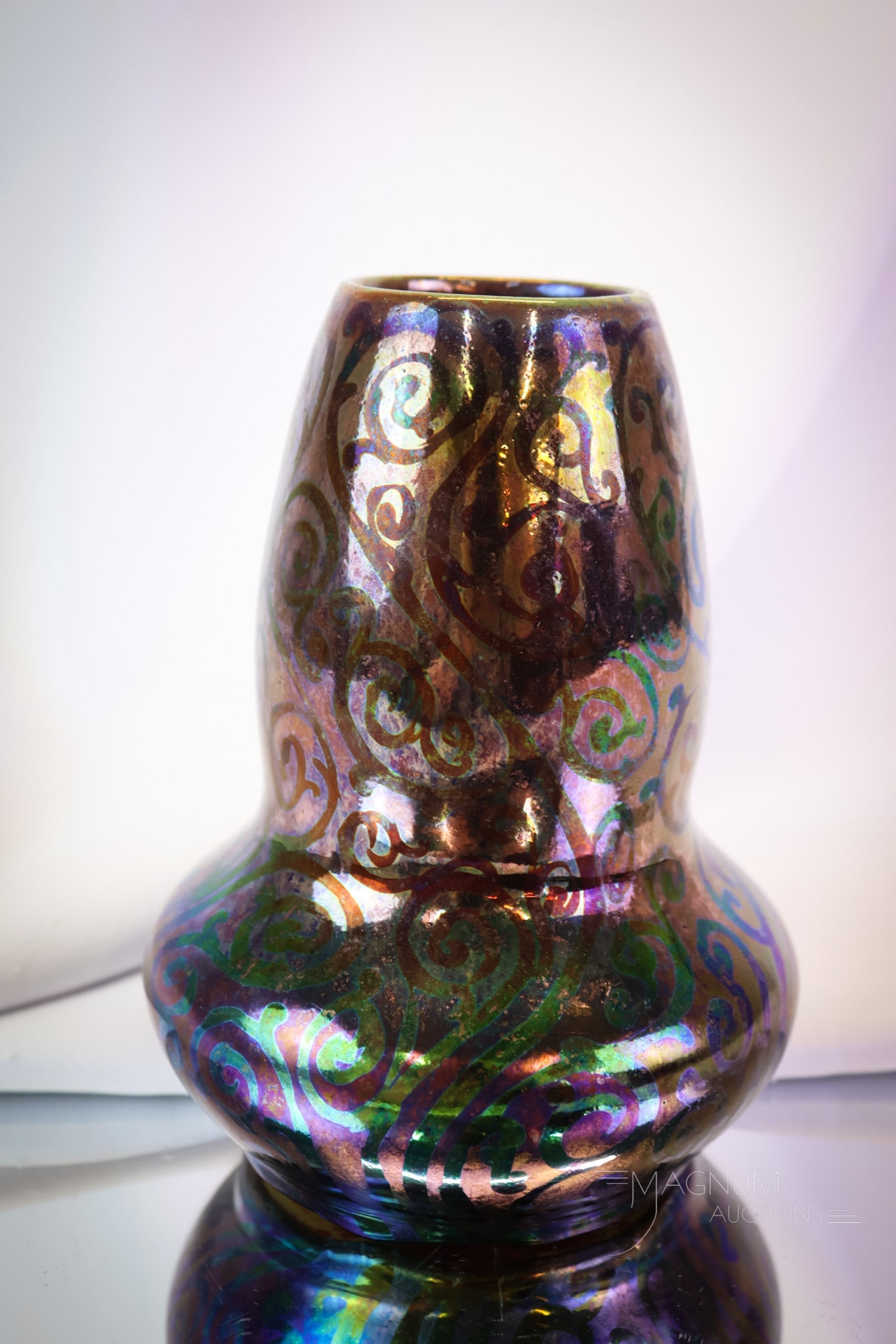 Signed Weller Sicard Iridescent Pottery Vase: A showy find in Weller Sicard pottery. This vase has lovely iridescence and scrolling decoration. It is signed on the side. The vase measures 6 1/2" tall. SHIPPING NOTICE: If you choose not to utilize