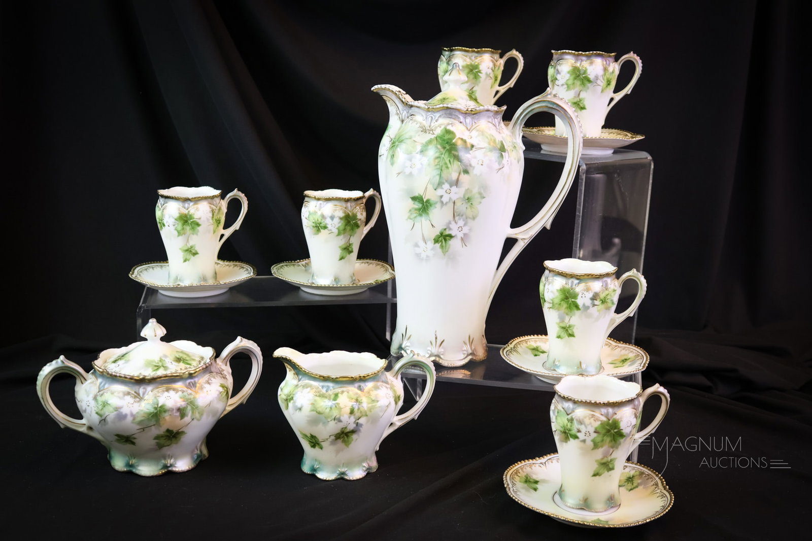 15 pc RS Prussia Porcelain Chocolate Tea Set: A delicate 15 pc Set of R.S. Prussia porcelain. This set includes a cream and sugar, six cups with saucers, and a pot with a lid. The tallest measures 9". SHIPPING NOTICE: If you choose not to utilize