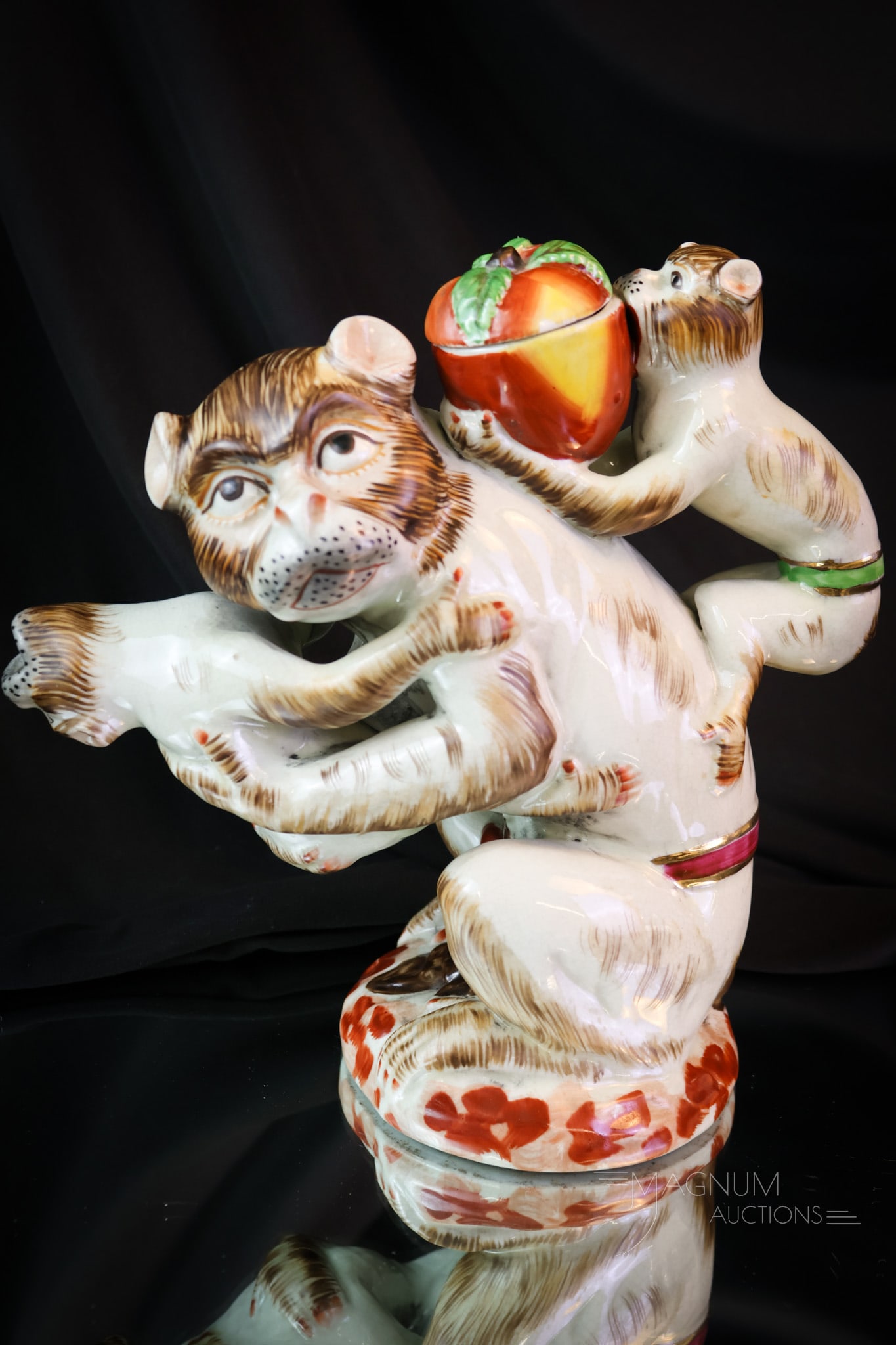 Staffodshire Porcelain Victorian Monkey Teapot: A charming find in Staffordshire porcelain. This is a teapot in the form of a Monkey. Very collectible, and this is a nice example with great colors. The piece measures 9 1/2" tall. SHIPPING NOTICE: I