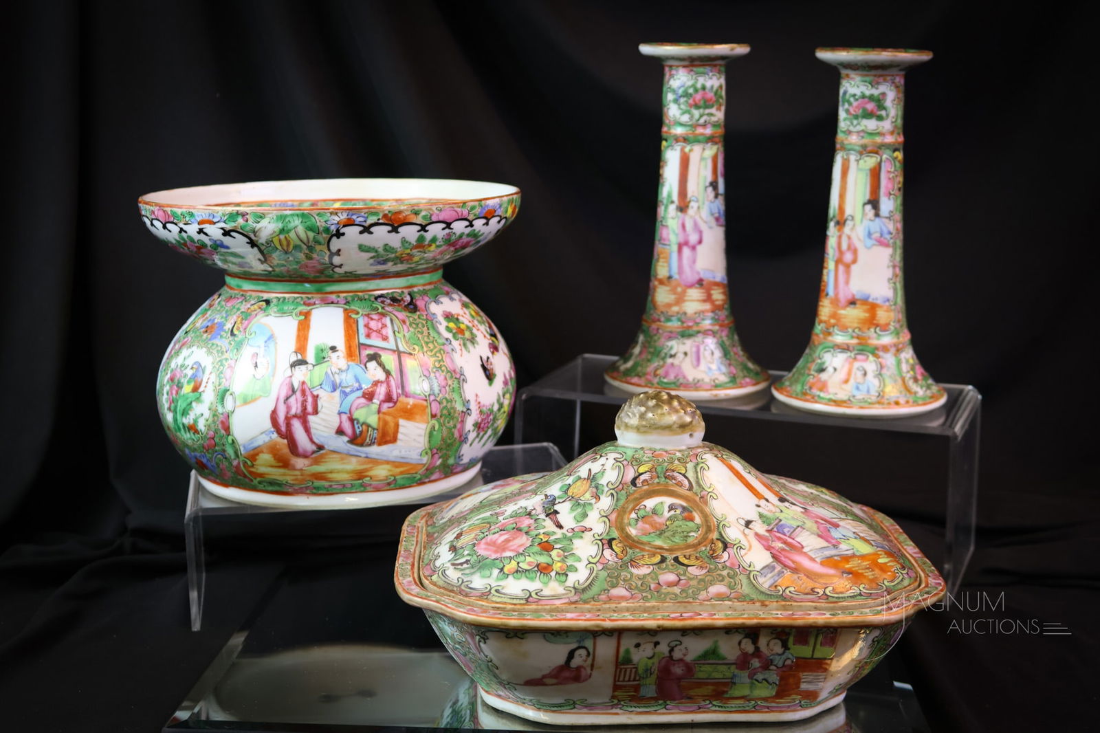 4pc Lot Chinese Export Famille Rose Porcelain: This lot offers a pair of candlesticks, a spittoon, and a covered vegetable dish. The tallest measures 8". The covered vegetable has a spider crack in the base. SHIPPING NOTICE: If you choose not to u