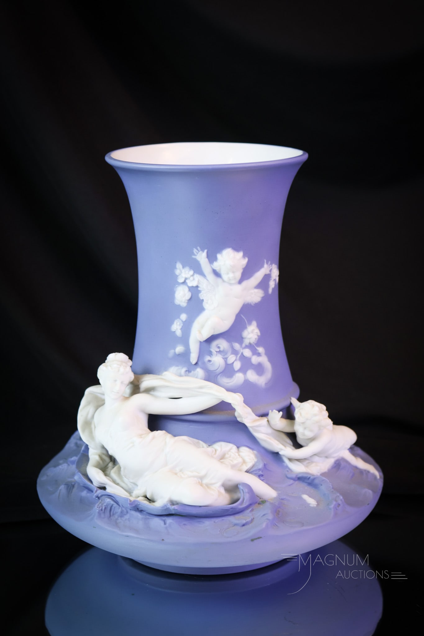 Volkstadt German Blue Jasperware Vase: A very attractive piece of Volkstadt German blue Jasperware in the form of a vase. This vase is decorated with cherubs and a woman. The vase measures 9" tall and 6 1/2" wide. SHIPPING NOTICE: If you c